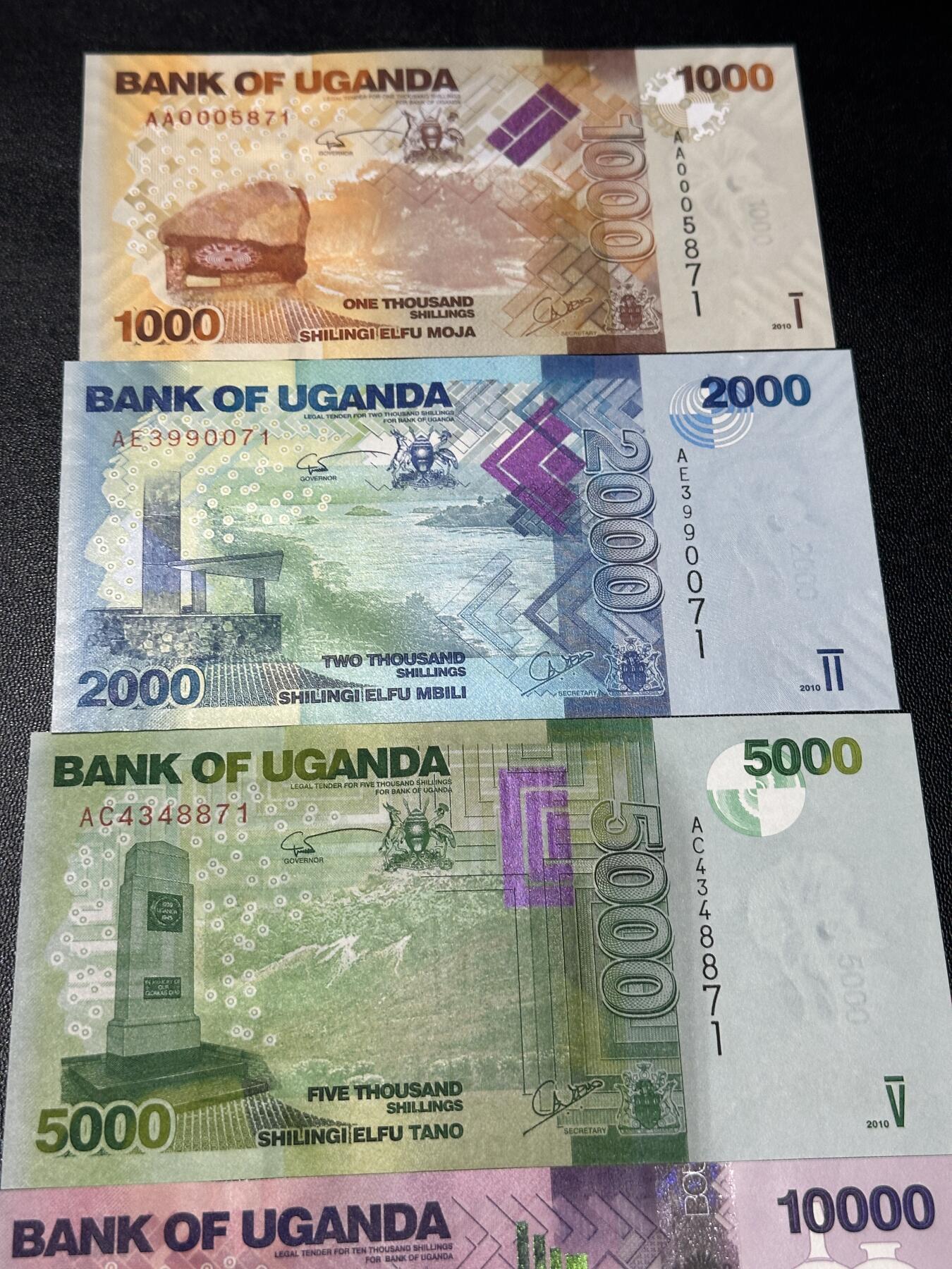 《外钞收藏家》第五百八十六期（品种丰富、精品多）（本平台长期征集拍品、欢迎藏友们联系合作） 乌干达1000-5万先令 五张一起 全新UNC 尾2同71