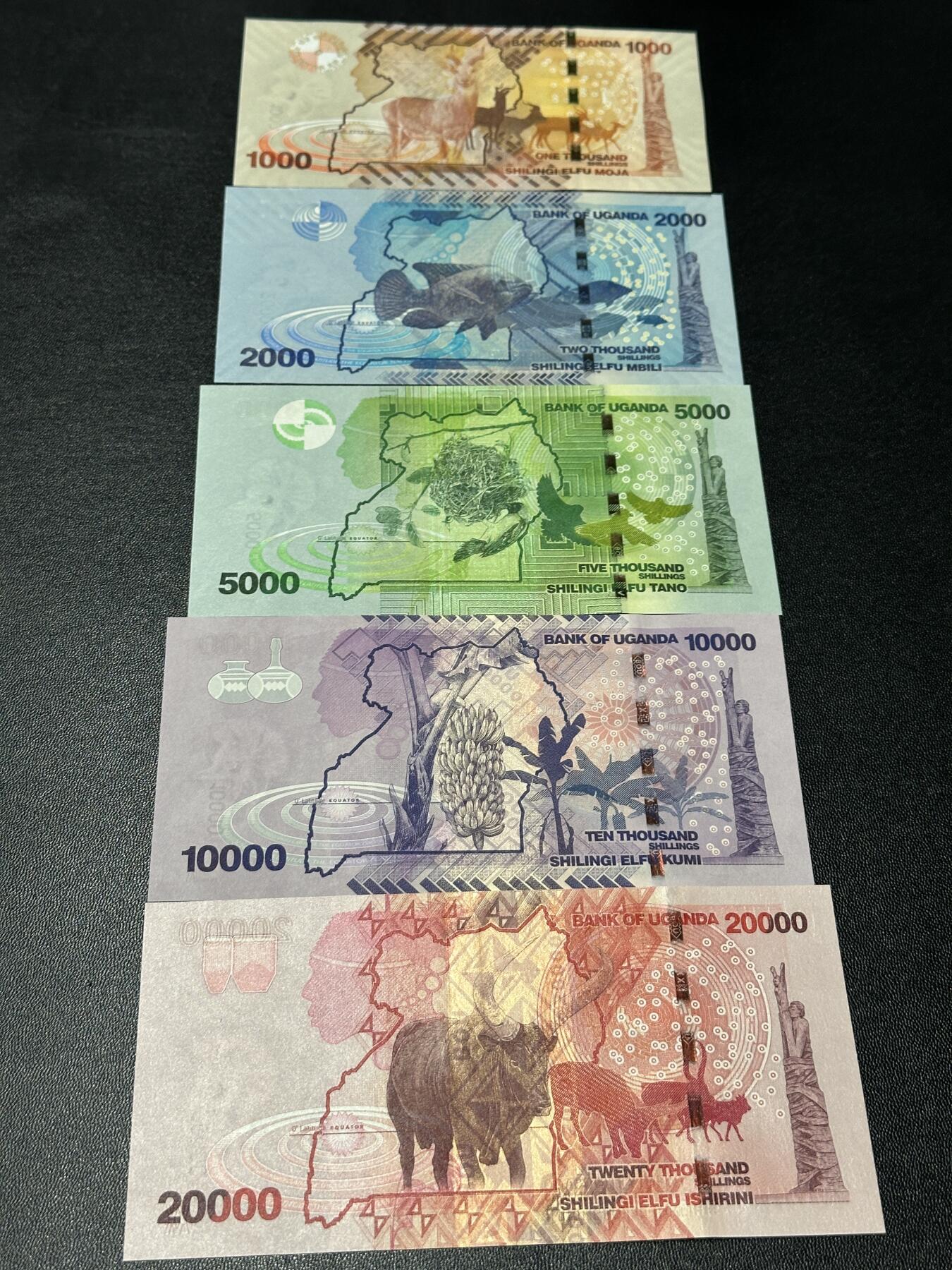 《外钞收藏家》第五百八十六期（品种丰富、精品多）（本平台长期征集拍品、欢迎藏友们联系合作） 乌干达1000-5万先令 五张一起 全新UNC 尾2同71