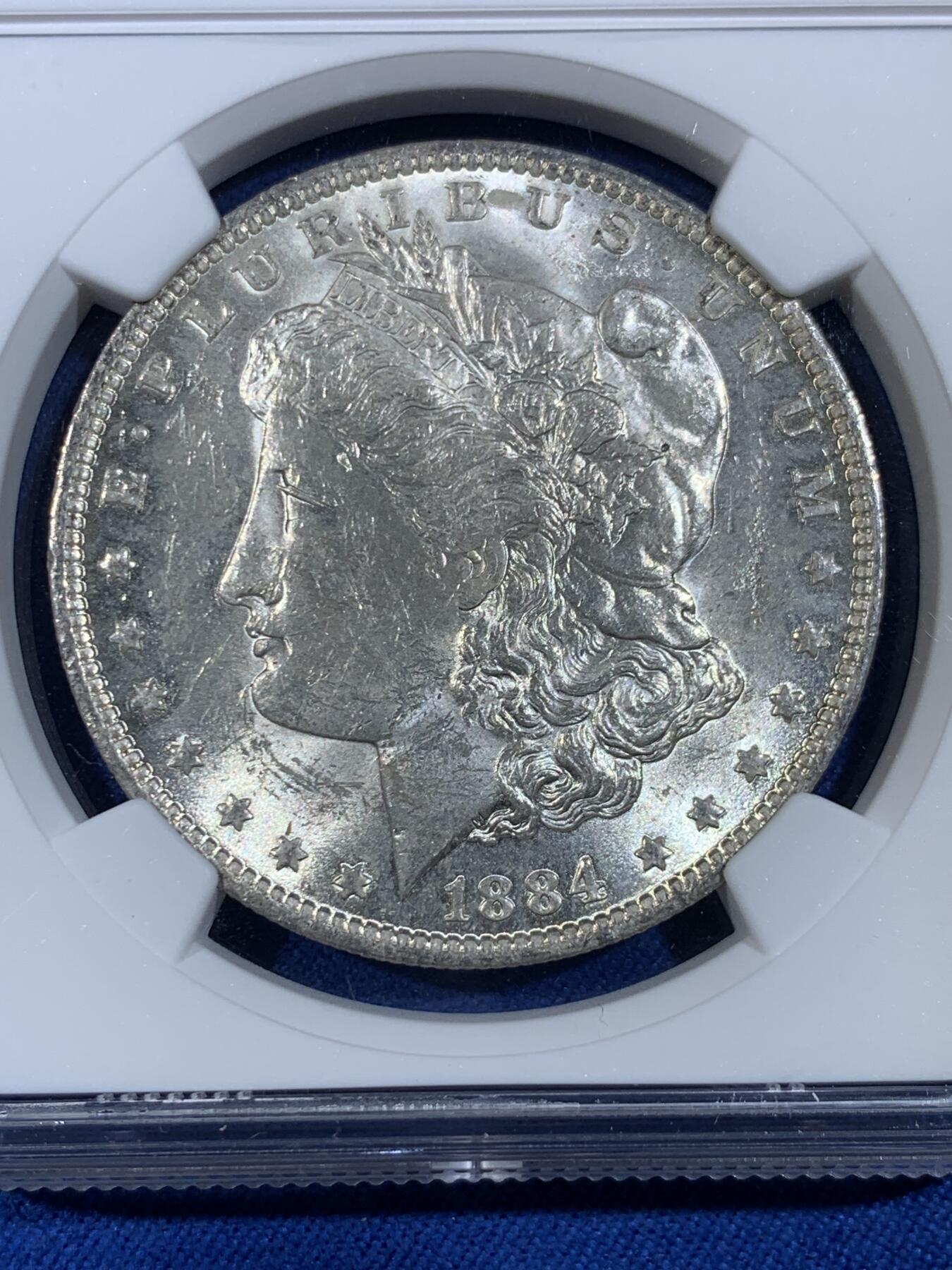 《竞宝斋》第439场 周日，周一，周二 3场连拍 （全场包邮） NGC MS62 美国1884年摩根1美元银币 卷拆白币 品相很不错 银价高涨 通货裸币逼近300 62分算是超值的选择