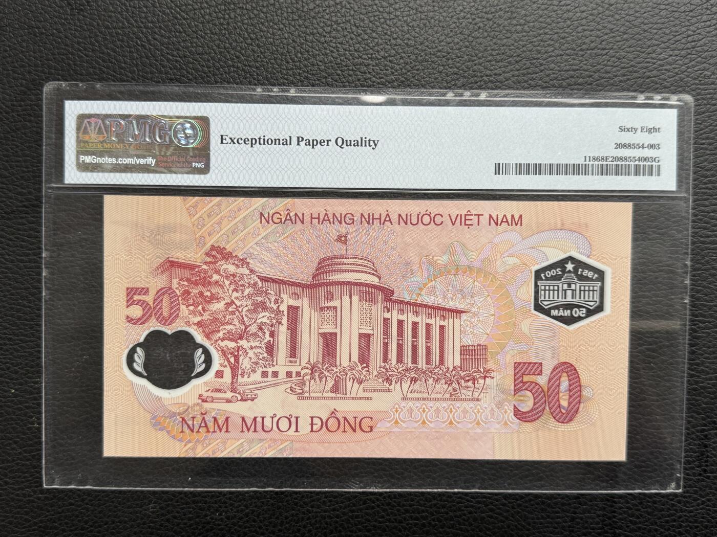 桂P钱币文化工作室拍卖第四十五期 越南国家银行成立五十周年纪念钞，PMG68高分，圆圆号0066888，非常好的号码，可遇不可求，值得终身收藏