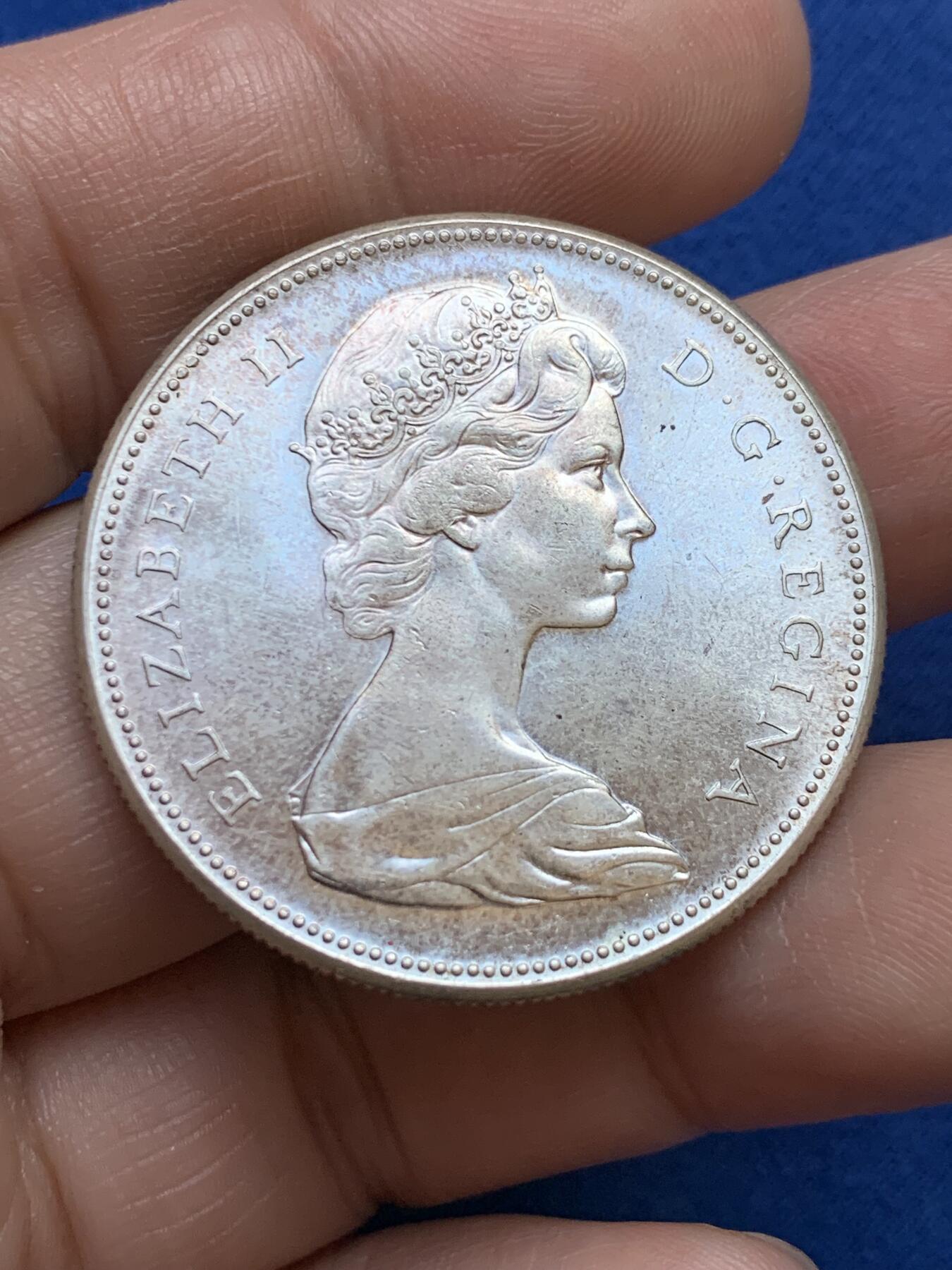 《竞宝斋》第439场 周日，周一，周二 3场连拍 （全场包邮） 加拿大1967年建国100周年大雁银币 强转光 品相很好，女王面淡紫彩