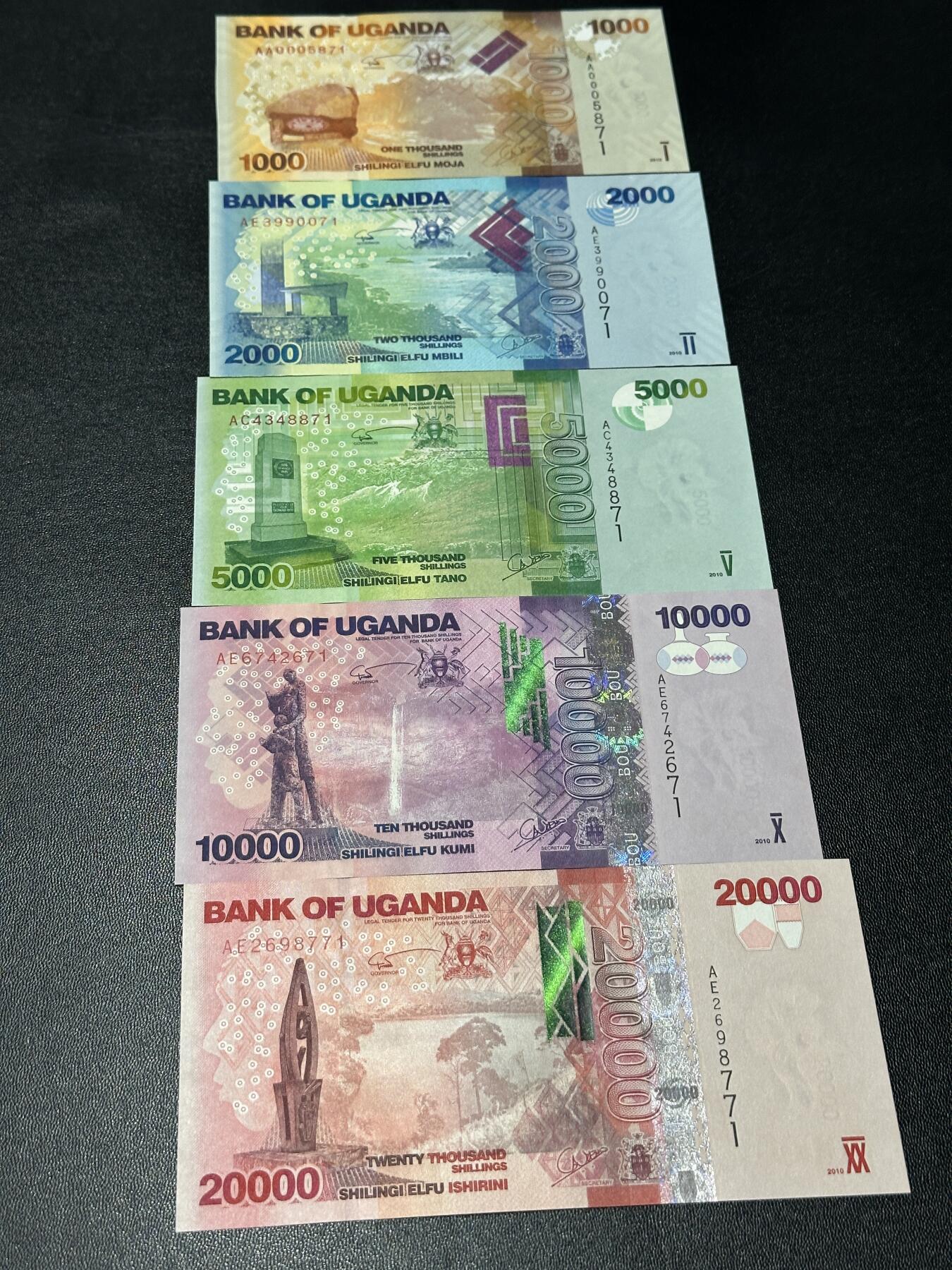 《外钞收藏家》第五百八十六期（品种丰富、精品多）（本平台长期征集拍品、欢迎藏友们联系合作） 乌干达1000-5万先令 五张一起 全新UNC 尾2同71