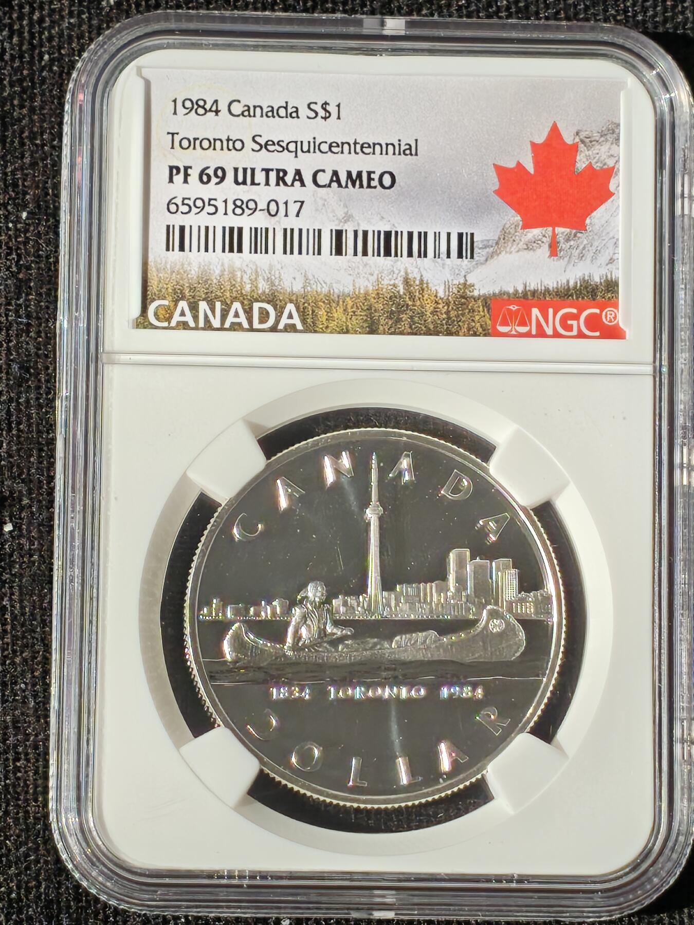 刘世昌艺术品销售中心～虎踞龙蟠*金杨在线联拍群第510期 加拿大1984年“多伦多建城150周年”1元精制纪念银币（NGC PF69UC 串号：6595189-017）1枚。