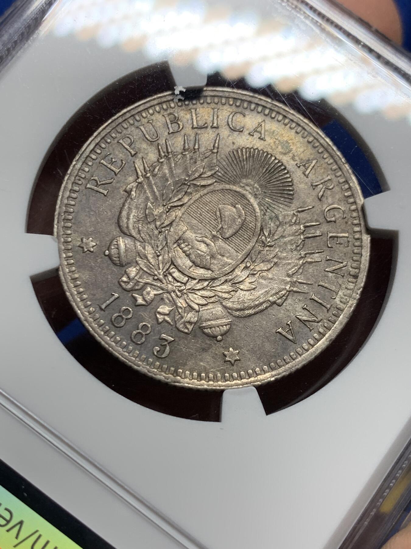 《竞宝斋》第439场 周日，周一，周二 3场连拍 （全场包邮） NGC AU58 阿根廷1883年自由女神50分银币 酱彩金五彩老黑包浆，深打有细节