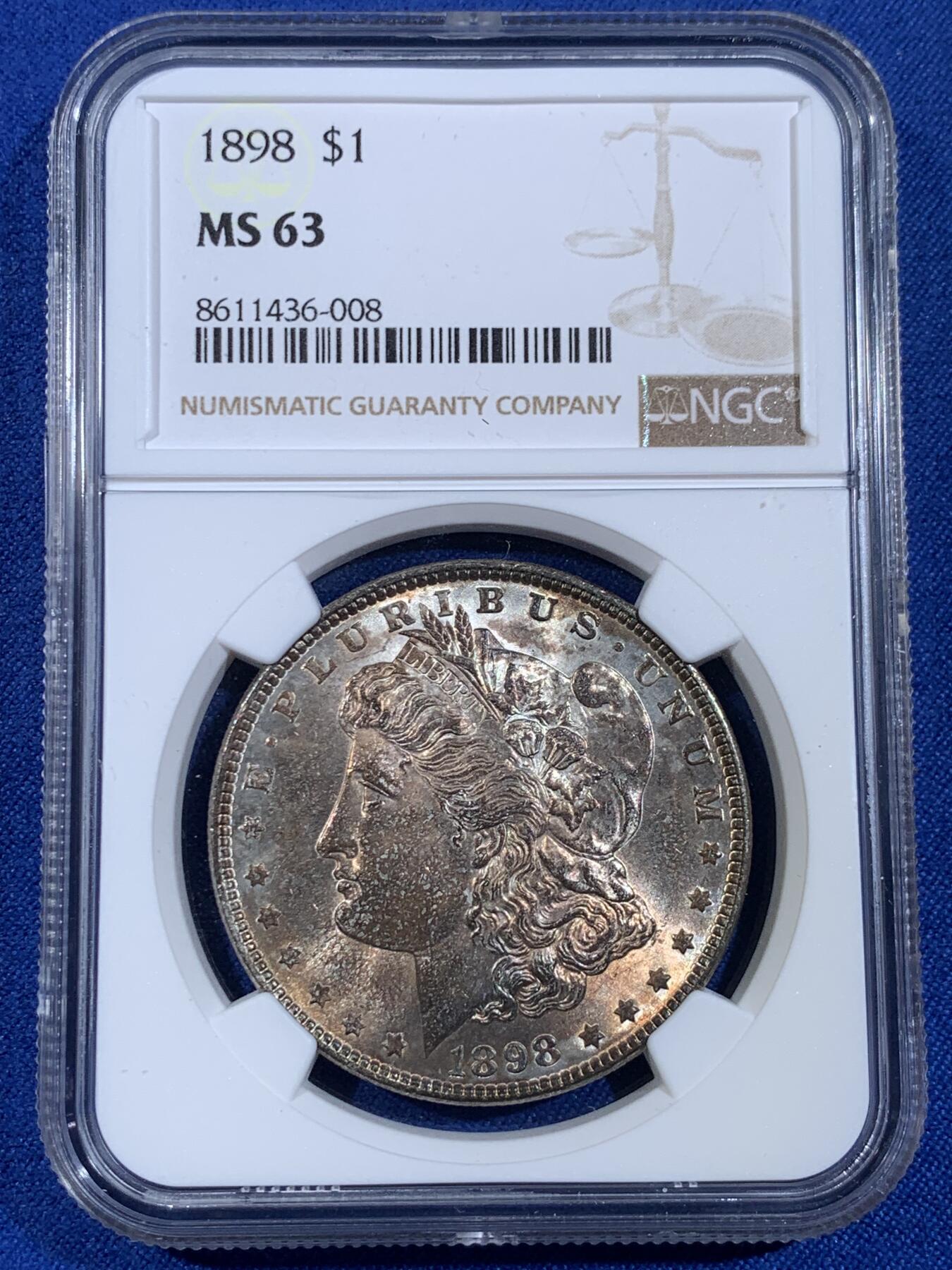 《竞宝斋》第439场 周日，周一，周二 3场连拍 （全场包邮） NGC MS63 美国1898年摩根银币P版，原汁原味五彩老包浆，转光强烈细节优秀。