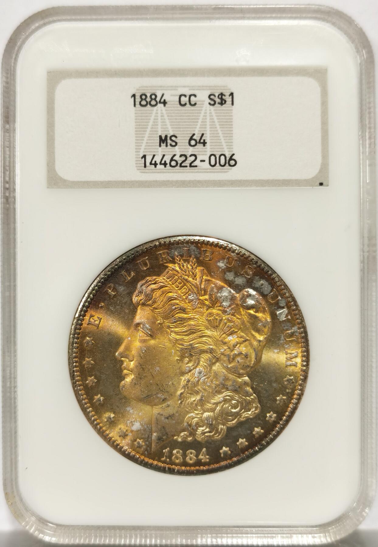 博洋堂藏家专场系列之美国钱币白金之夜专场暨第148期（全场包邮） NGC MS64 美国1884 CC 摩根 老肥皂盒 严评 人像面均匀覆盖极为漂亮金黄色包浆 鹰面环状金色包浆 此版别难得有此完美包浆 极为难得 绝佳藏品