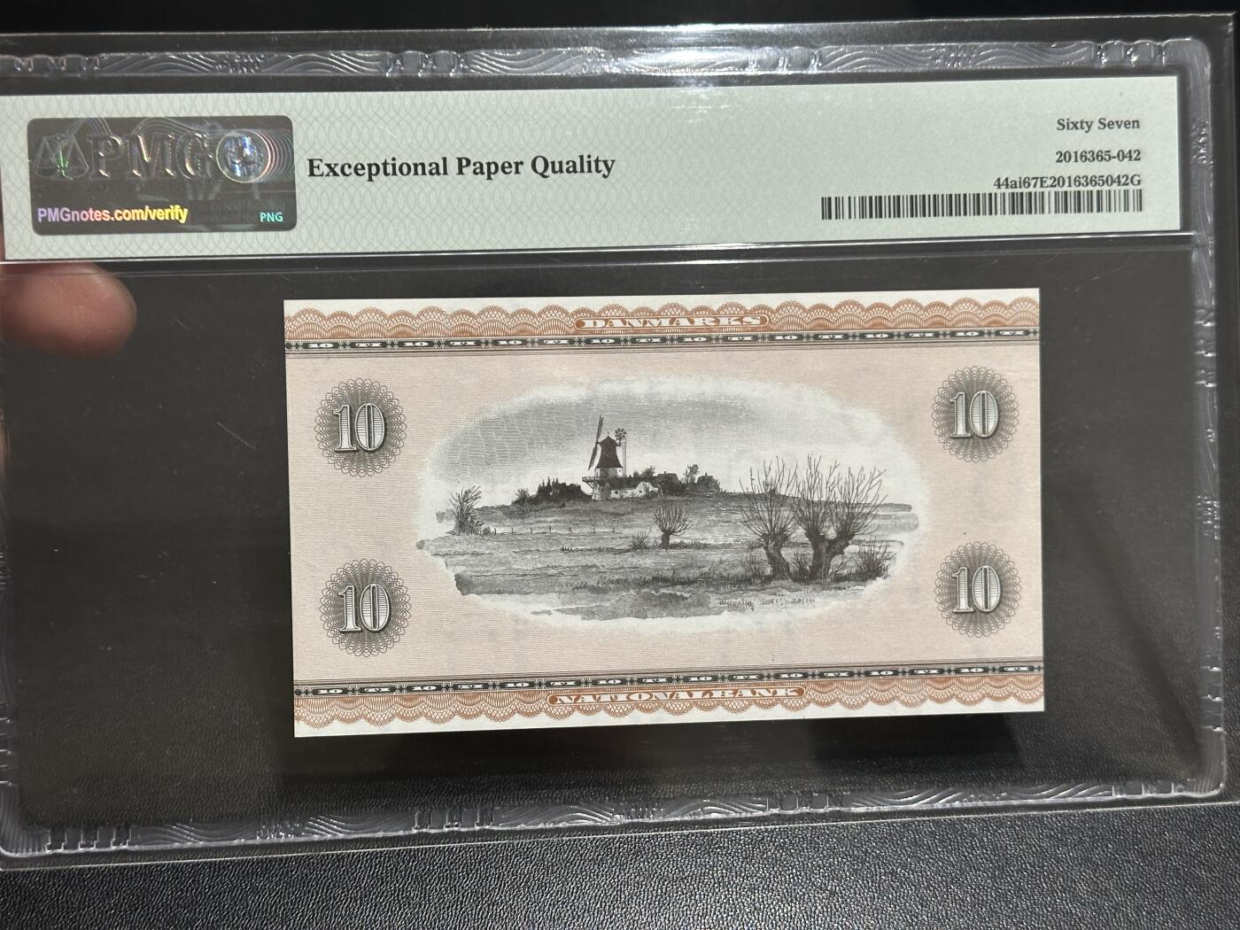 《外钞收藏家》第五百八十六期（品种丰富、精品多）（本平台长期征集拍品、欢迎藏友们联系合作） 1974年丹麦10克朗 PMG67 尾668靓号