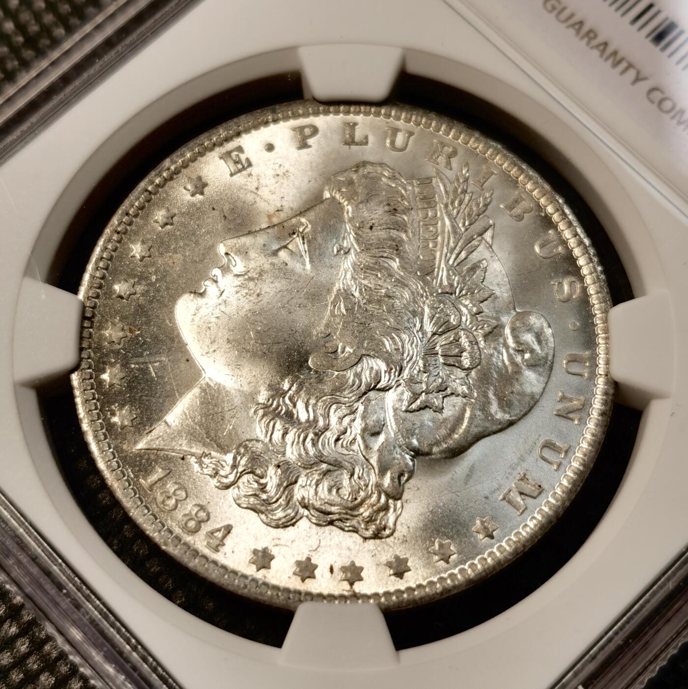 甄臻铺-世界币章拍卖（第40期）送拍享返佣金等优惠多多 NGC-MS64 1884年美国O版摩根，正面币面干净，背面淡淡月芽儿包浆