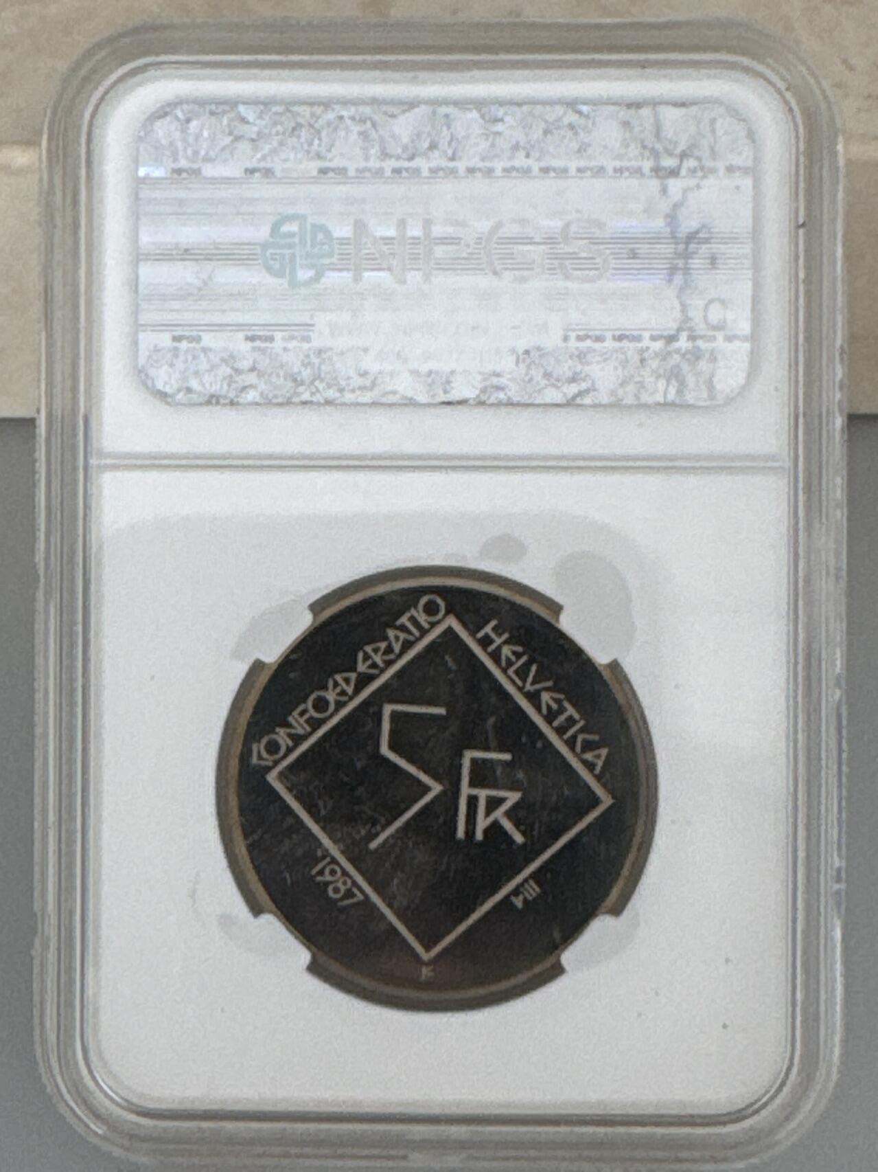 ❤️【币观天下】❤️ 第331期钱币拍卖- 2025.11.21周五晚上6点半场-长期征集拍品 克劳斯世界硬币大赛最佳贸易币瑞士1987年现代建筑大师勒·柯布西耶诞辰100周年NPGS众诚评级封装精制纪念币铜镍合金13.2克直径31.45毫米