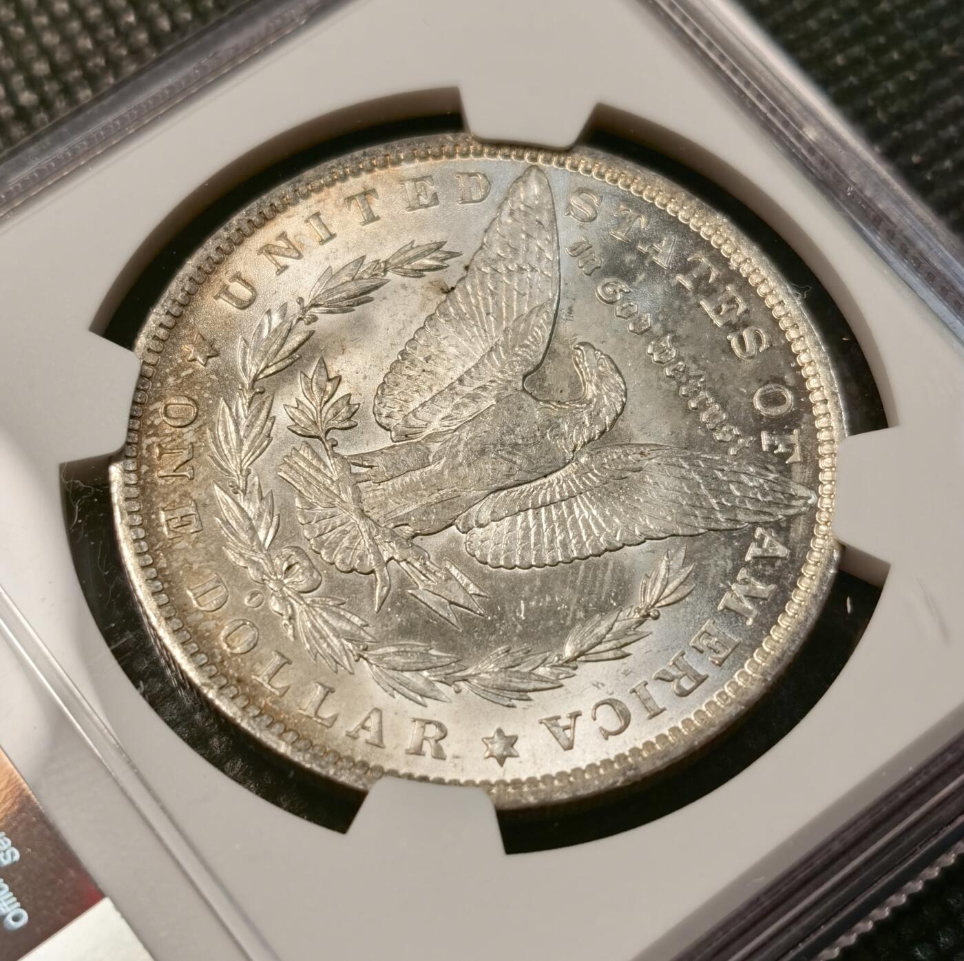 甄臻铺-世界币章拍卖（第40期）送拍享返佣金等优惠多多 NGC-MS64 1884年美国O版摩根，正面币面干净，背面淡淡月芽儿包浆