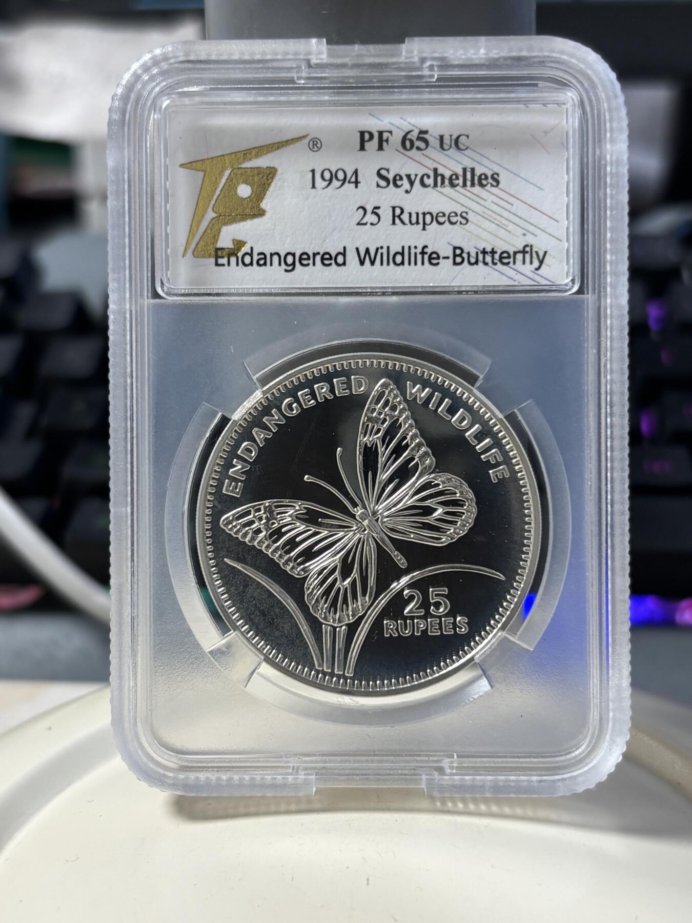 第182期拍卖 塞舌尔1994年珍稀动物系列蝴蝶纪念银币TQG-PF65，925银，28.28克