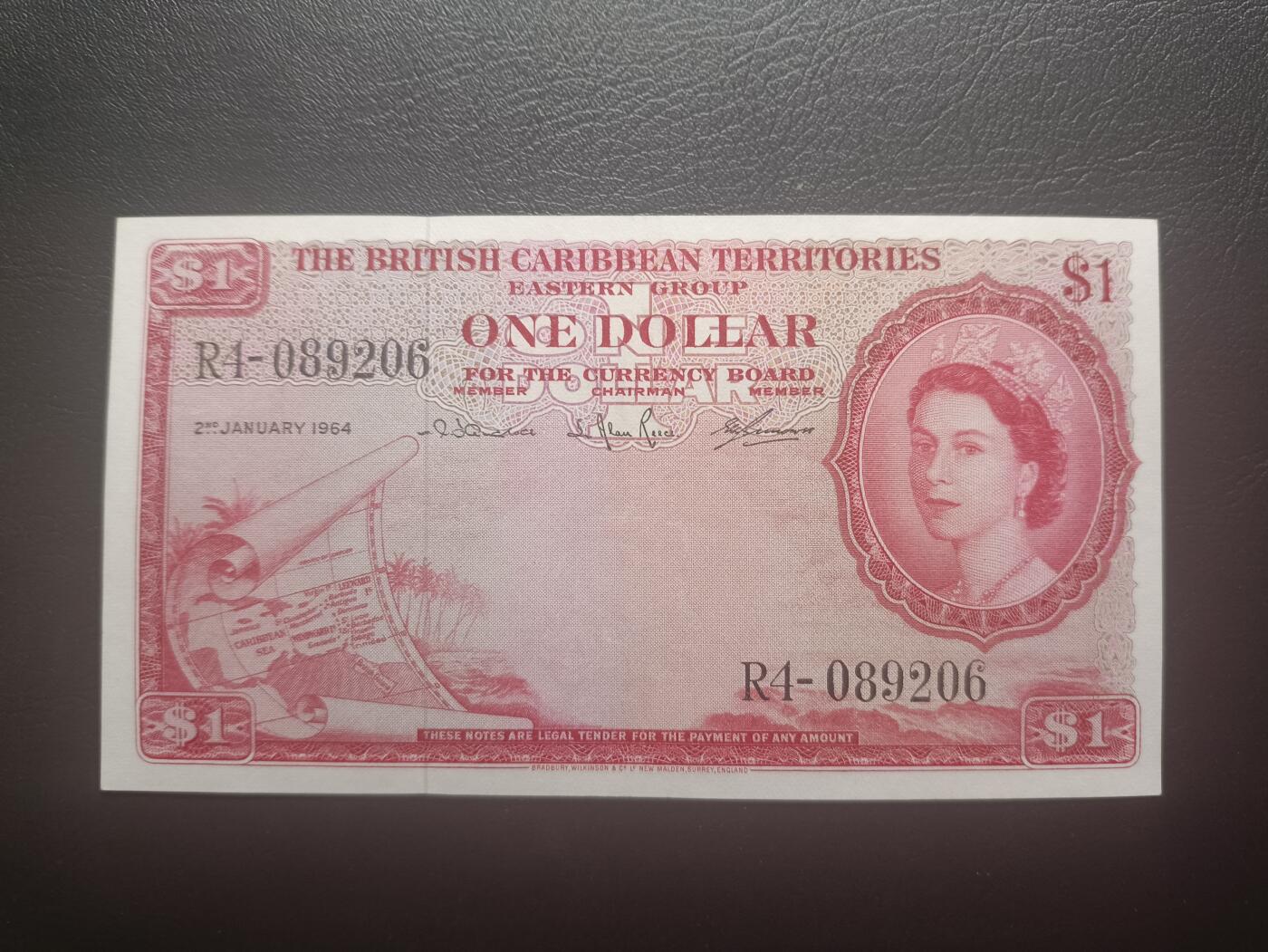 2025十一月第五期，总第203期 英属加勒比领地（现东加勒比共同体）1964年1元AUNC，大皇冠女王和各构成殖民地徽章