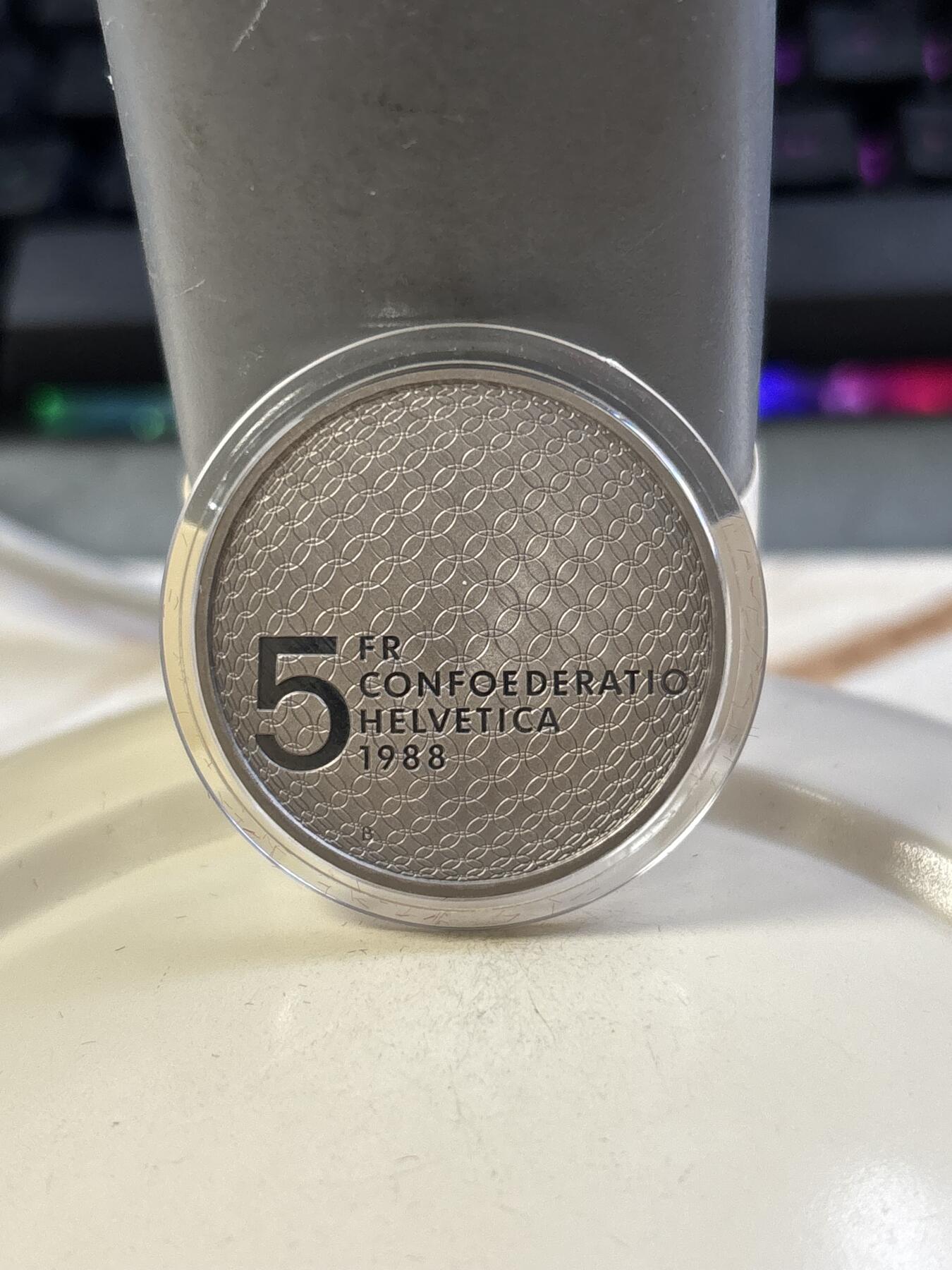 第182期拍卖 获奖瑞士1988年汉城奥运和平鸽和五环铜镍精制版本纪念币带盒，获克劳斯1990年度最佳艺术币大奖，