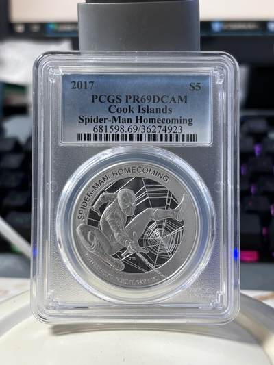 第182期拍卖 - 库克2017电影蜘蛛侠回归1盎司银币PCGS-PR69，999银，发行5000枚，评级盒有3个破口