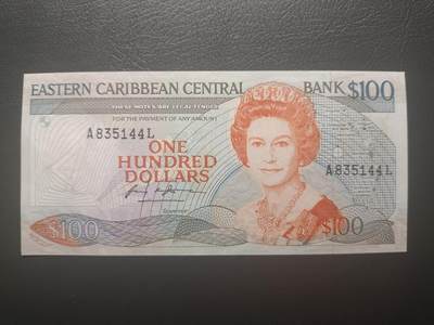 2025十一月第五期，总第203期 - 东加勒比共同体1985版100元AUNC圣卢西亚印刷，中年女王和海滩椰林，少见最高面值