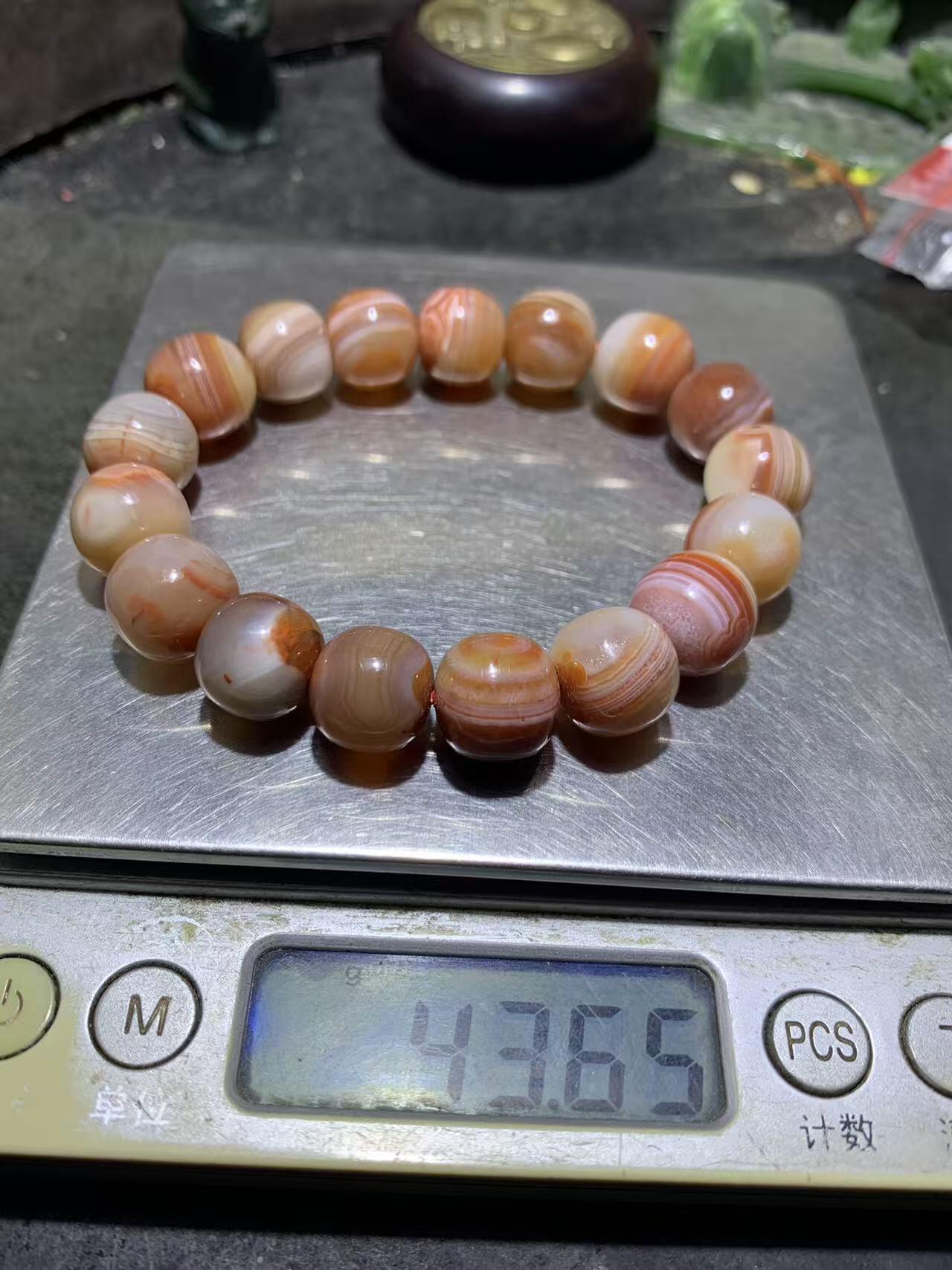 川料南红玛瑙随形原皮老形桶珠手串一条，