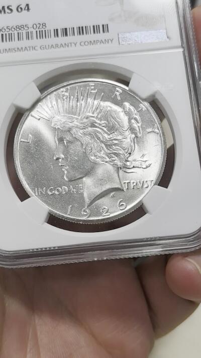 博洋堂世界钱币拍卖第147期（全场包邮） NGC MS64 美国1926年和平银币 特年品种，数量非常少，从数据库中看几乎是常见那几个年份1/15左右的量。此枚强车轮光底板极其出色，可以称得上是严重低评的一枚