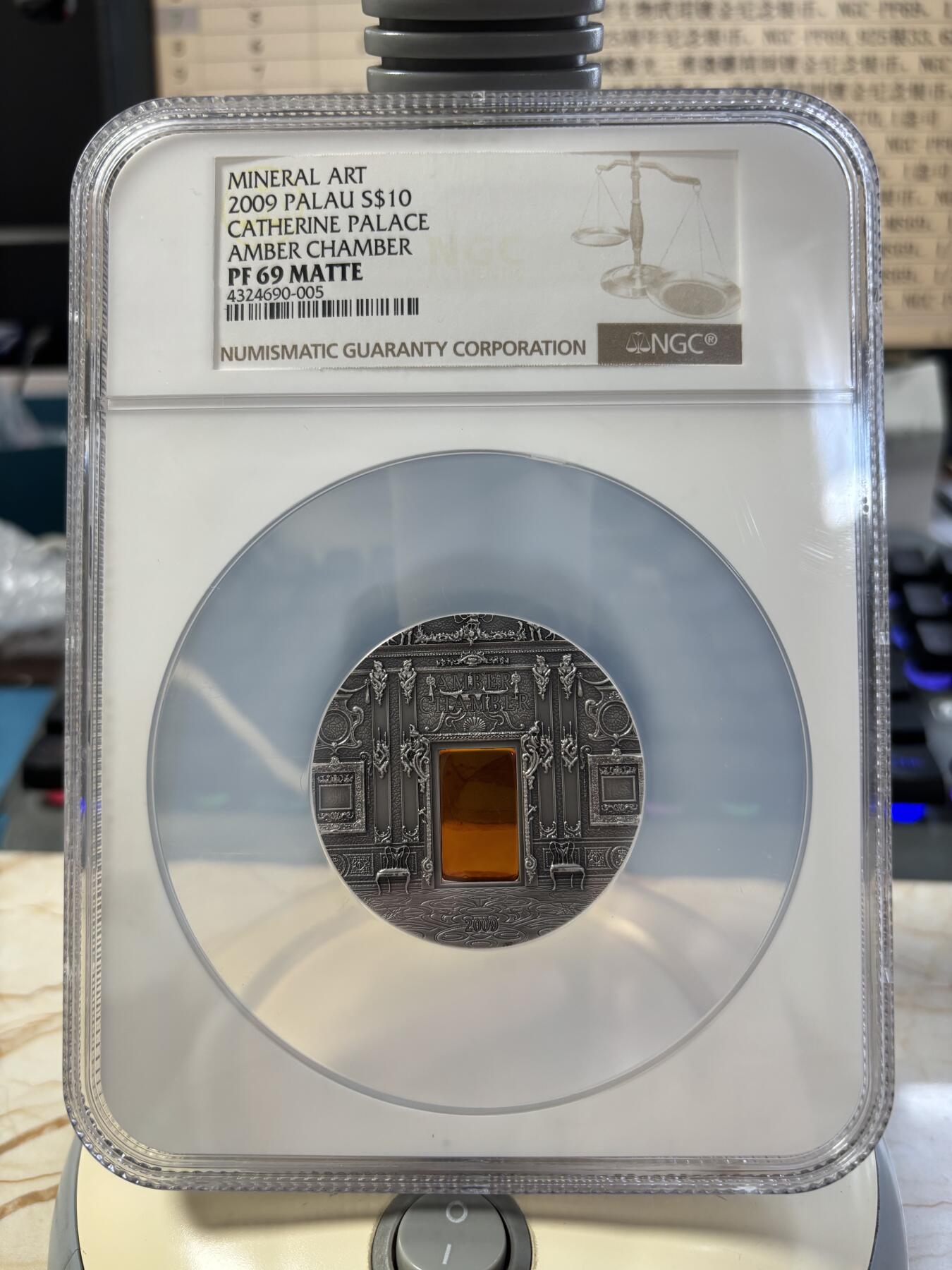第182期拍卖 帕劳2009年矿物艺术琥珀镶嵌圣加大教堂仿古银币NGC-PF69无盒无证书，2盎司，999银，