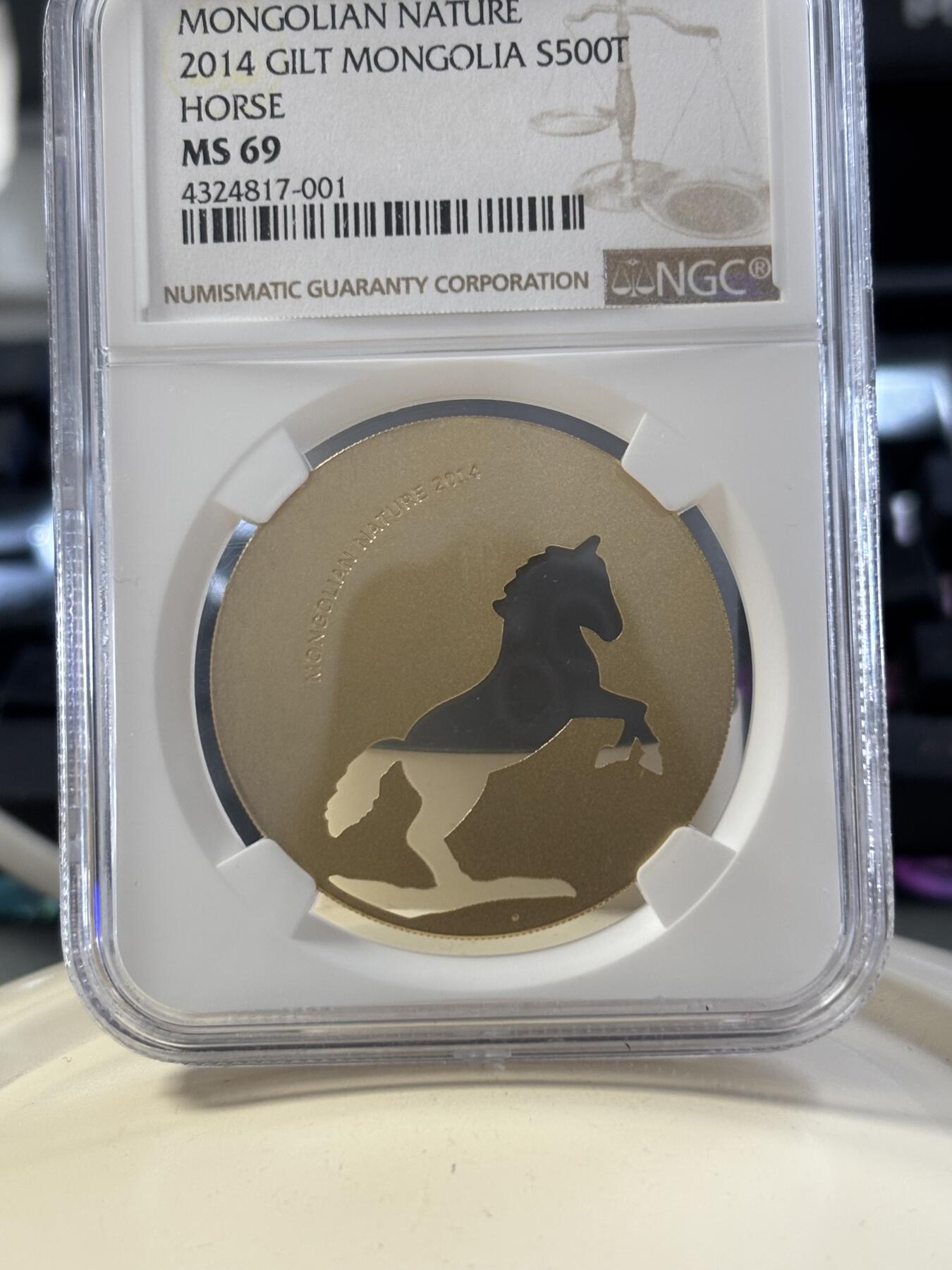 第182期拍卖 蒙古2014年自然动物系列骏马镂空镀金银币NGC-MS69，1/2盎司，925银镀金