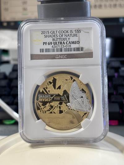 第182期拍卖 - 库克2015年自然之影蝴蝶激光三维微雕精制镀金纪念银币NGC-PF69，25克，925银