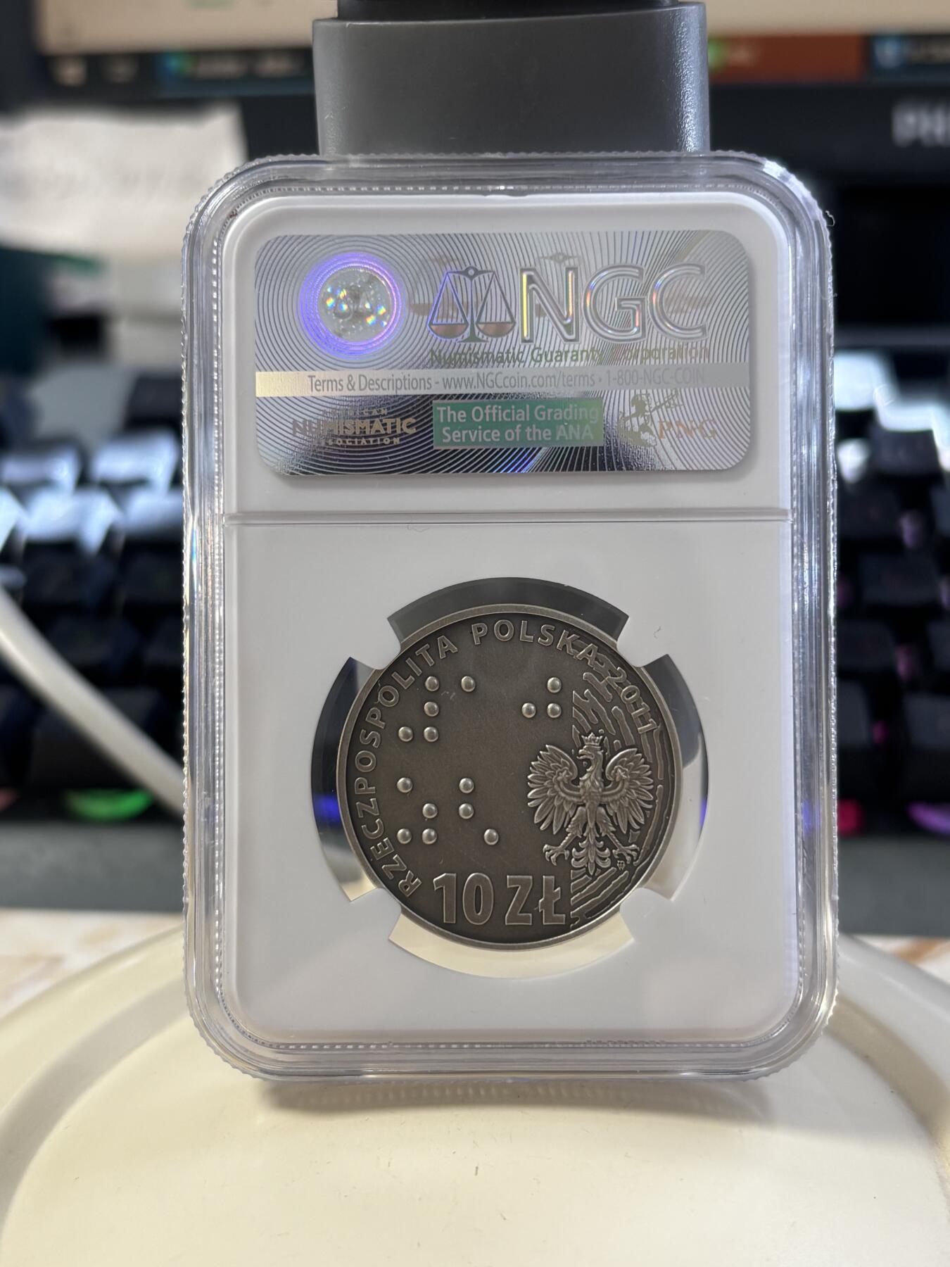 第182期拍卖 获奖币波兰2011年盲人保护协会成立100周年纪念银币NGC-PF69,14.14克，2013年克劳斯最富激情币