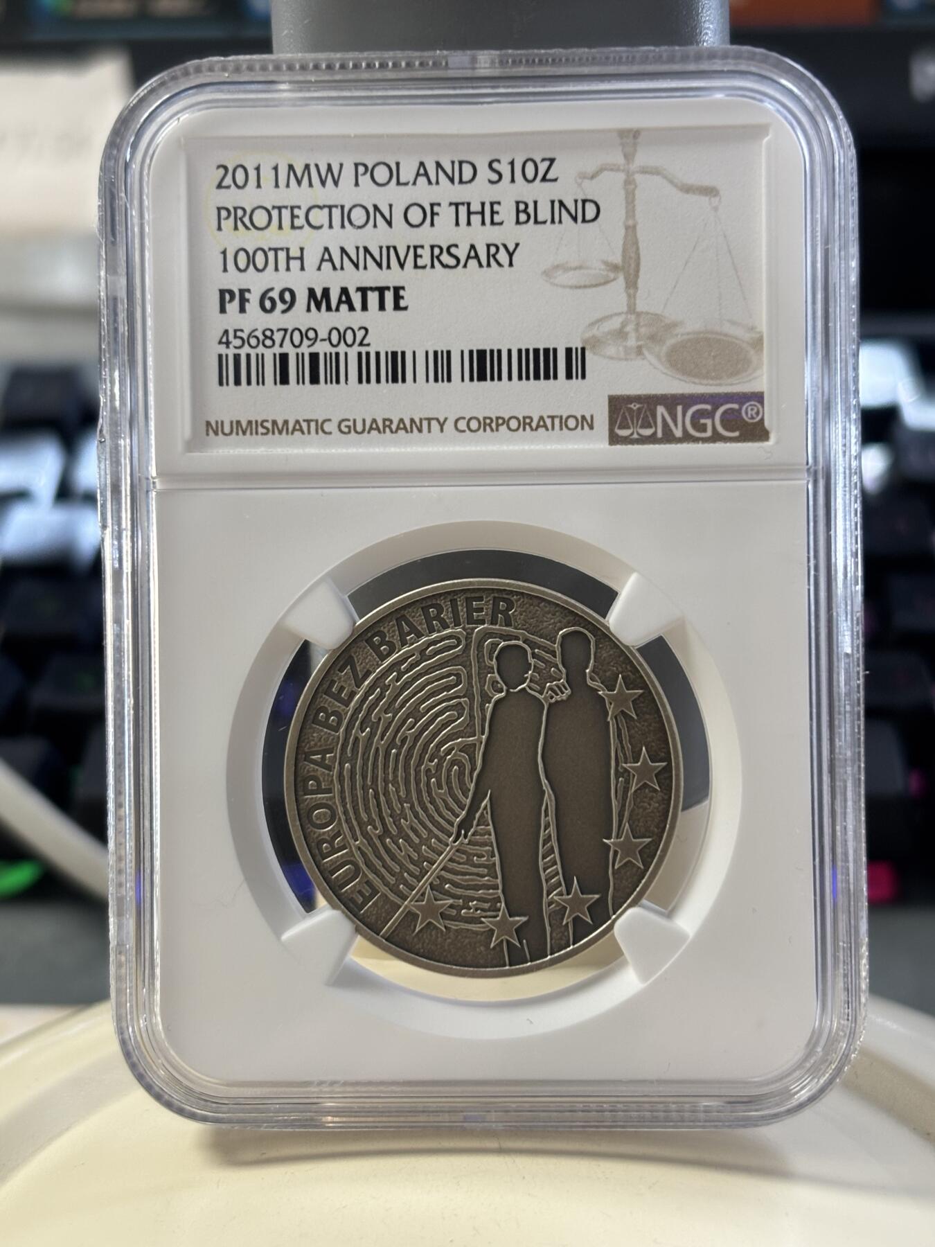 第182期拍卖 获奖币波兰2011年盲人保护协会成立100周年纪念银币NGC-PF69,14.14克，2013年克劳斯最富激情币