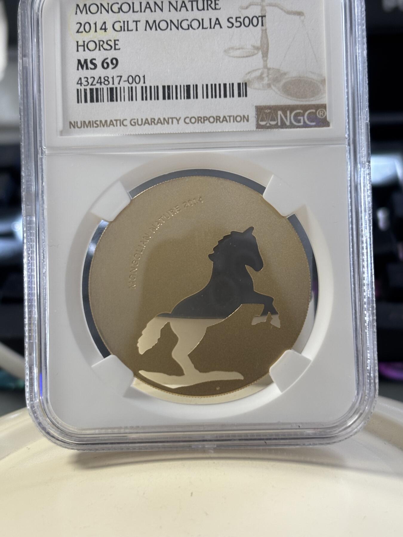 第182期拍卖 蒙古2014年自然动物系列骏马镂空镀金银币NGC-MS69，1/2盎司，925银镀金
