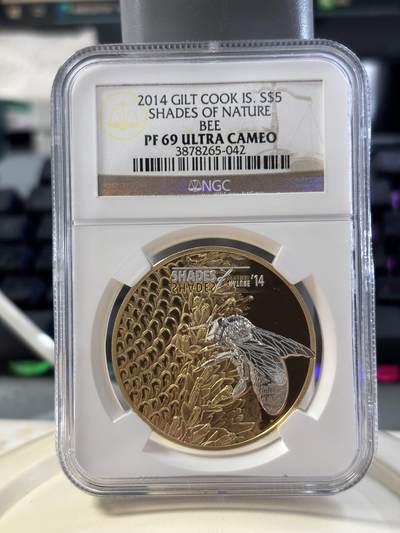 第182期拍卖 - 库克2014年系列龙头自然之影蜜蜂激光三维微雕精制镀金纪念银币NGC-PF69，25克，925银