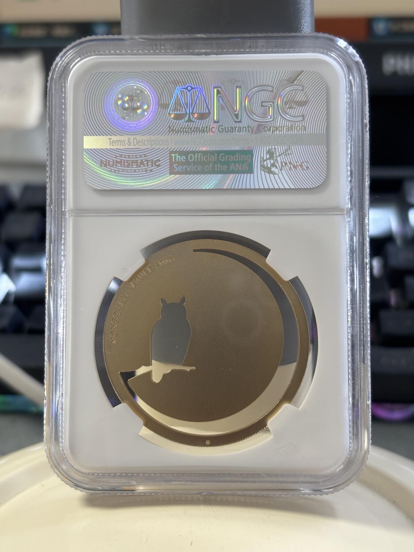 第182期拍卖 蒙古2016年自然动物系列猫头鹰镂空镀金银币NGC-MS69，1/2盎司，925银镀金