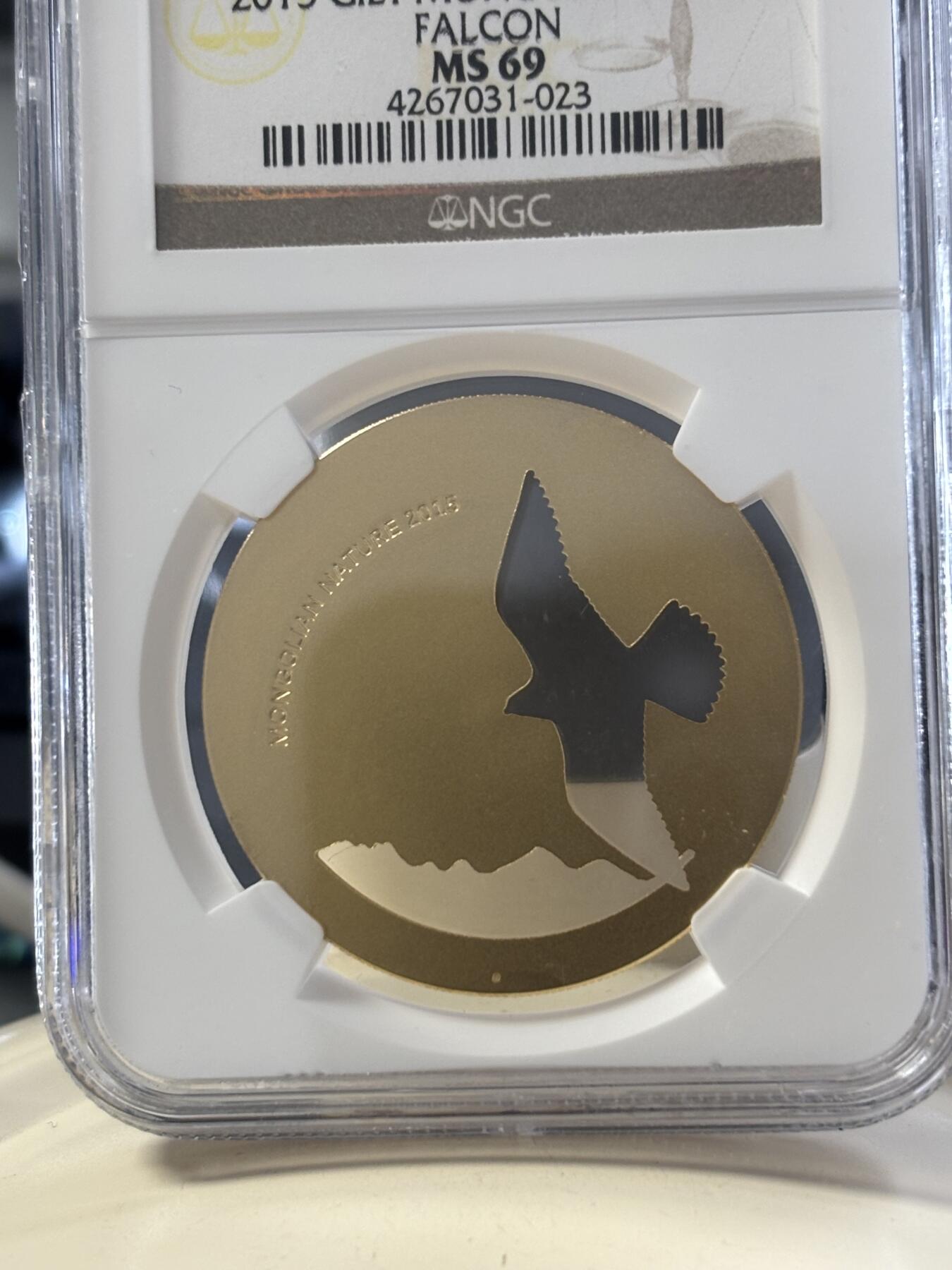 第182期拍卖 蒙古2015年自然动物系列雄鹰镂空镀金银币NGC-MS69，1/2盎司，925银镀金
