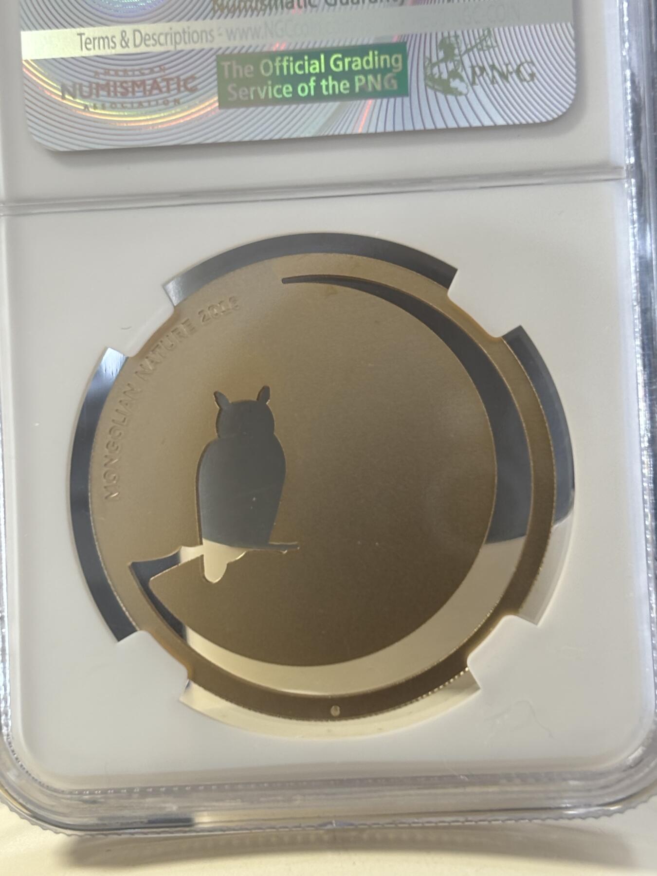 第182期拍卖 蒙古2016年自然动物系列猫头鹰镂空镀金银币NGC-MS69，1/2盎司，925银镀金