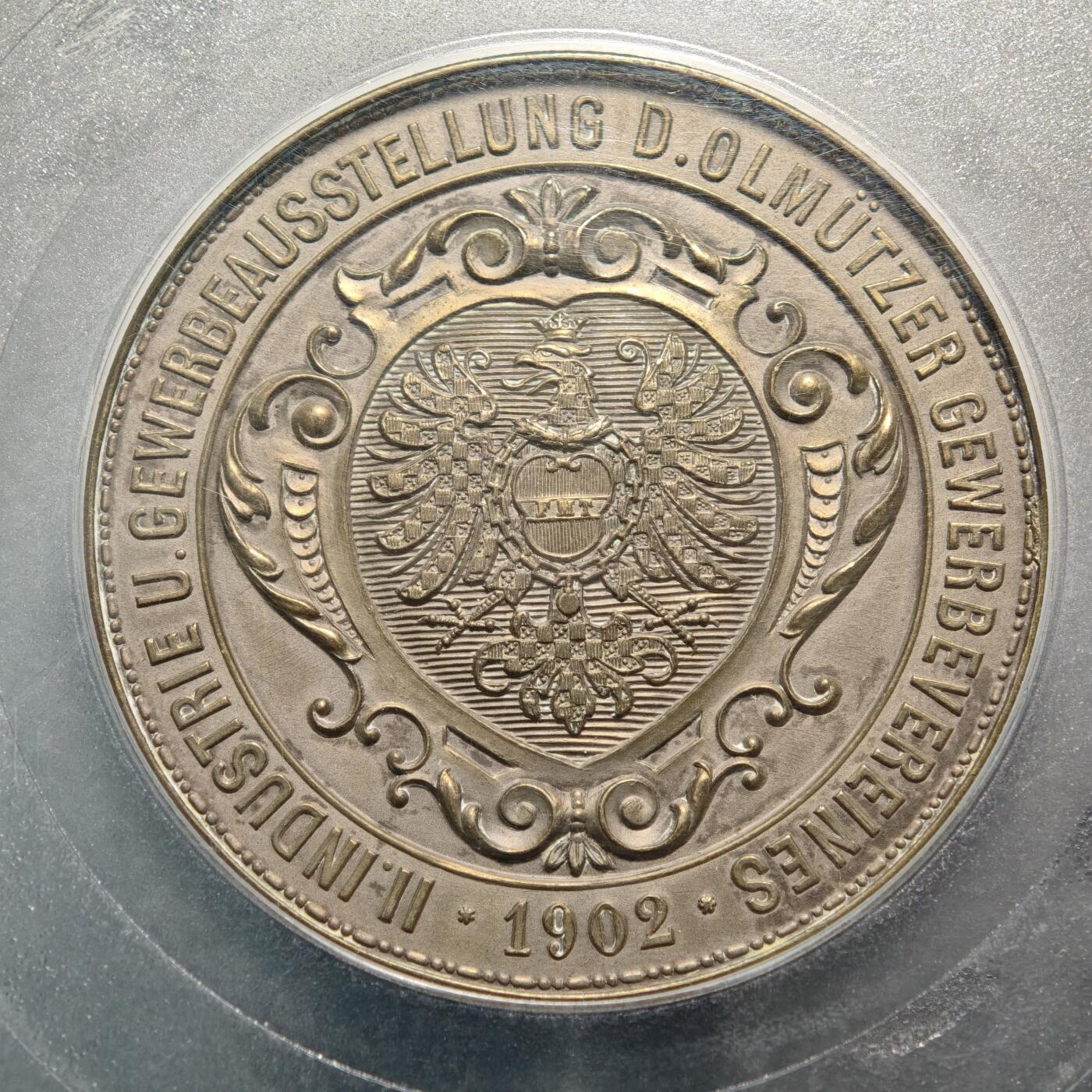 【德藏】世界币章拍卖第154期（拍品征集中~欢迎藏友联系） 1902年 奥地利奥尔穆茨手工业协会第二届工业与商业展览纪念大铜章 50mm PCGS MS63 设计精美细腻