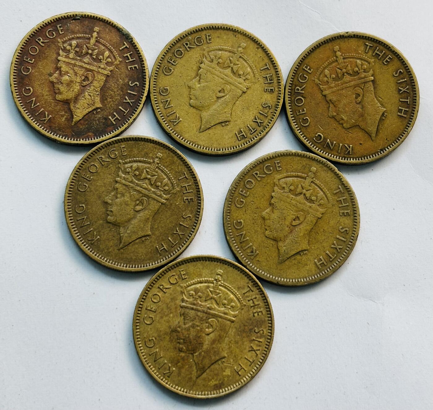文馨钱币收藏第 282 场，【 长期接收代拍品】，加拿大老铜代用币，银币，德三系列场 少见英属香港乔治六世时期首发年关门年大一毫铜币 6 枚