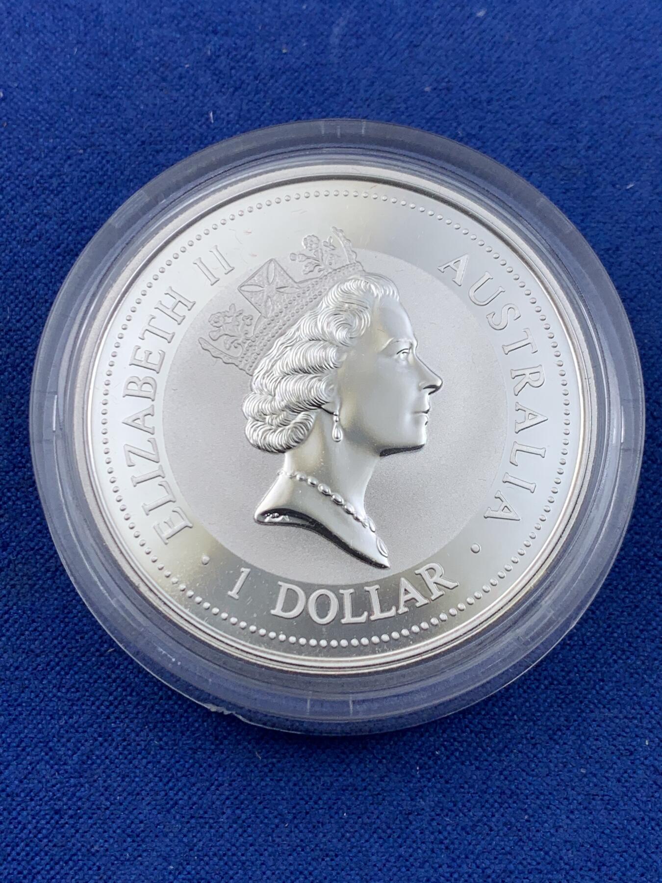 《竞宝斋》第441场 周日，周一，2场连拍 （全场包邮） 澳大利亚 1997年 笑翠鸟 熊猫镶嵌银币 每枚含纯银1盎司999银，镶嵌部分重约0.5克黄金，发行1.5万枚，为上海国际钱币展而发行，细节见图。