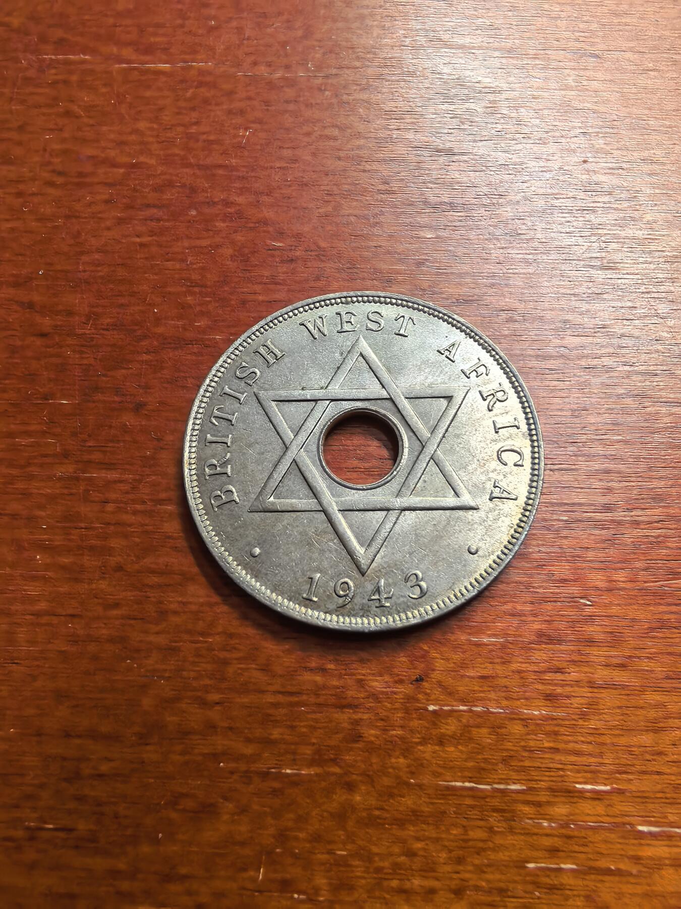 长老汇蛇年精选第七十七场拍卖 1943英属西非乔治六世1便士中孔铜镍币，喜敦版，小年，克书MS60分20美金，未流通品