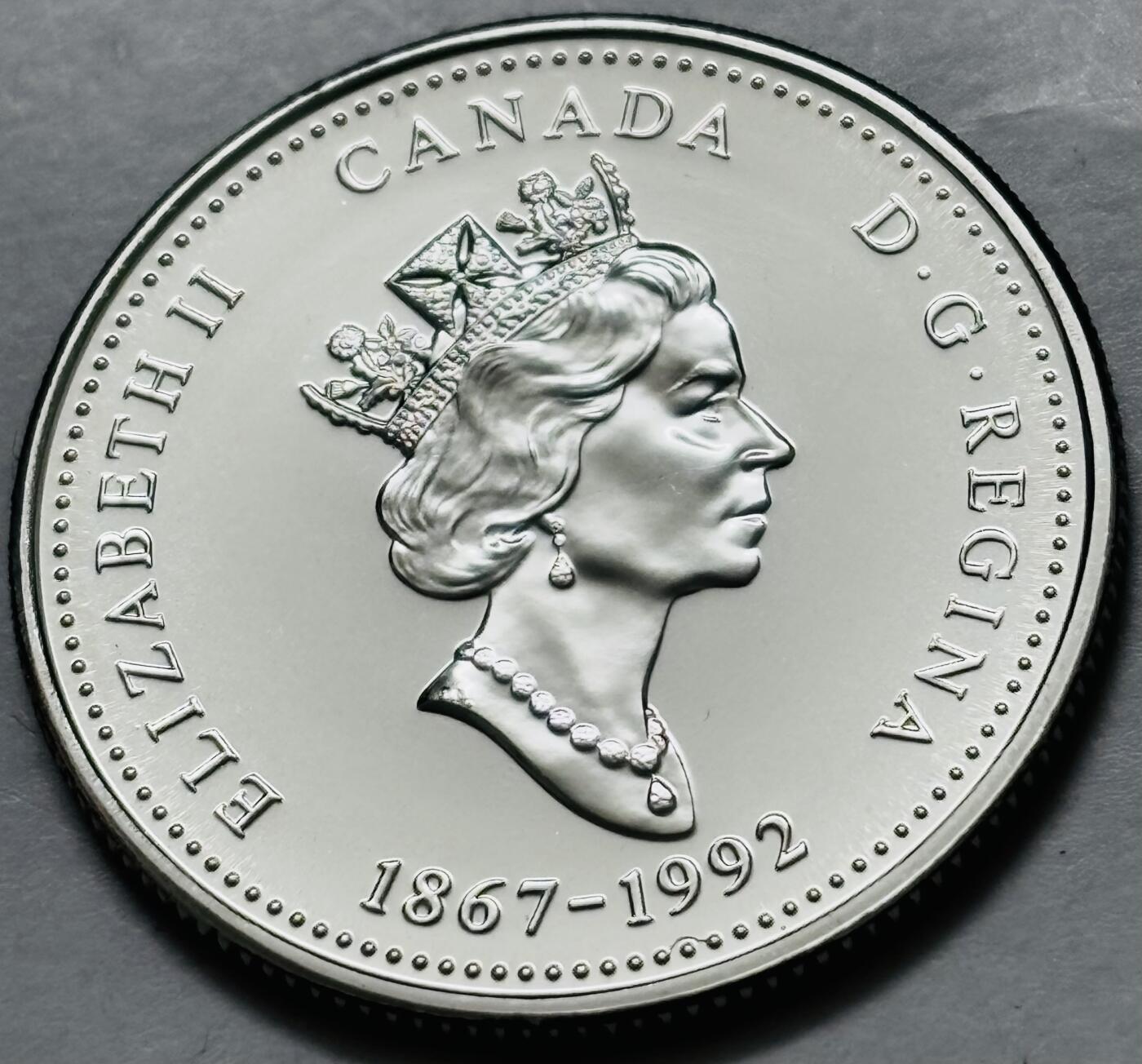 文馨钱币收藏第 282 场，【 长期接收代拍品】，加拿大老铜代用币，银币，德三系列场 少见全新未流通 1992 年加拿大 125 周年安尼夫联邦-纽芬兰 25 分纪念币