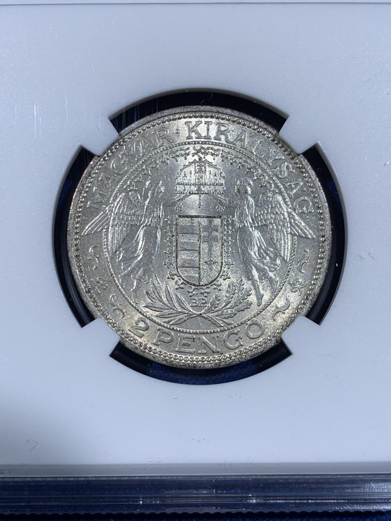 《竞宝斋》第441场 周日，周一，2场连拍 （全场包邮） NGC MS63 匈牙利王国1938年2潘果银币 漂亮的双天使盾徽圣母抱婴 完整原光漂亮