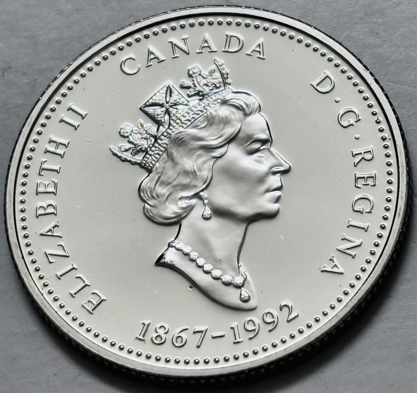 文馨钱币收藏第 282 场，【 长期接收代拍品】，加拿大老铜代用币，银币，德三系列场 少见全新未流通 1992 年加拿大 不列颠哥伦比亚联邦成立 25 周年 25 分纪念币