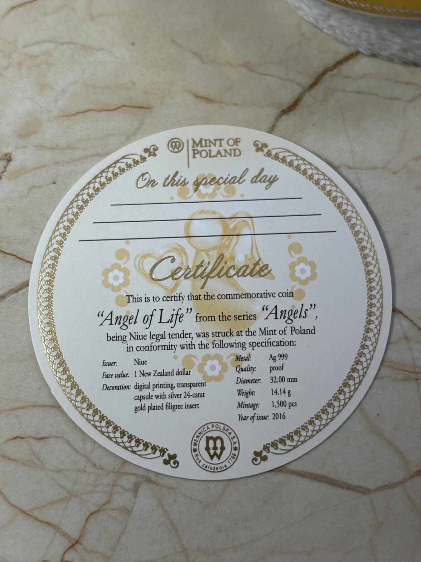 第183期拍卖 纽埃2016年生命天使镂空内嵌镀金银片彩色银币， 999银，14.14克，发行1500枚