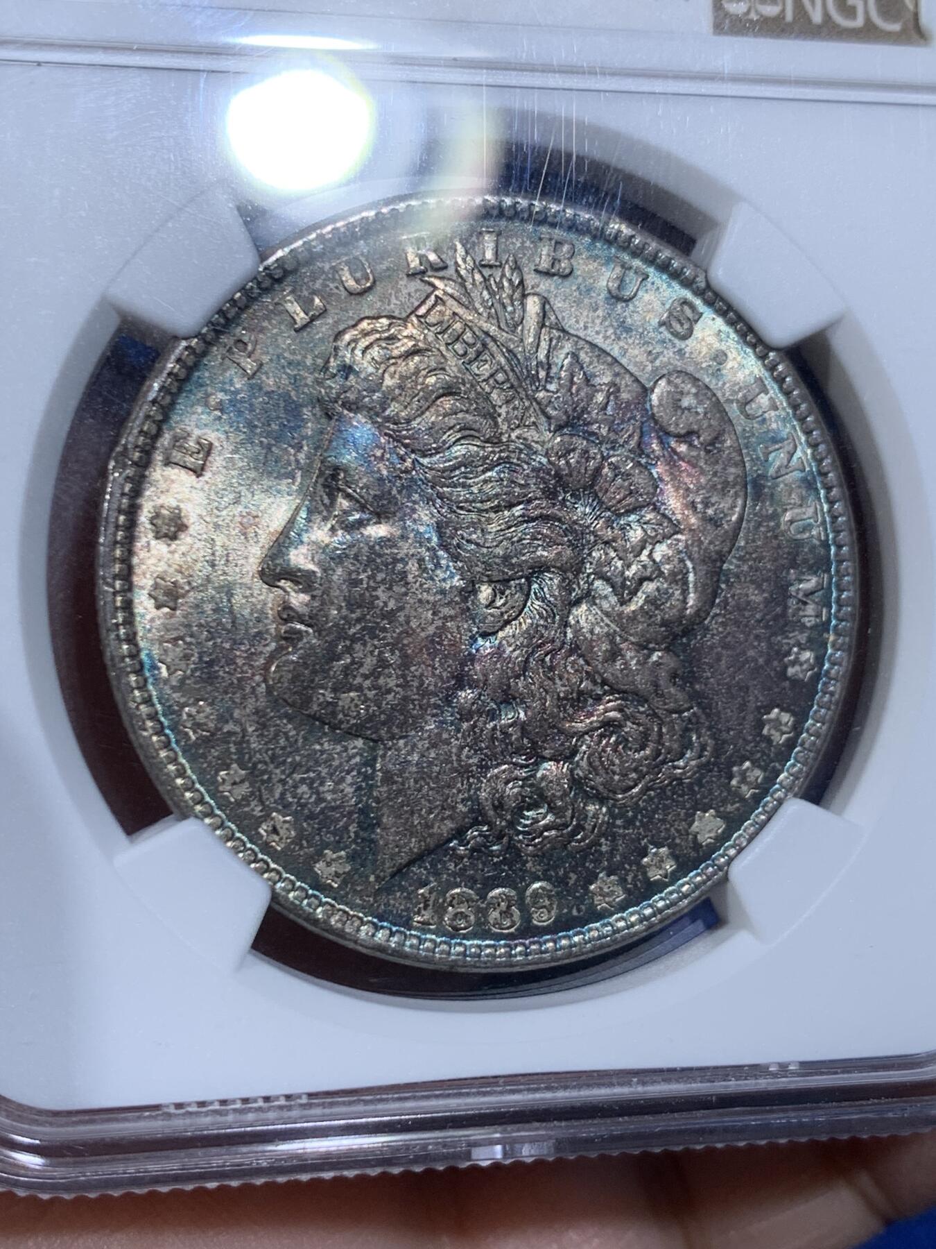 《竞宝斋》第441场 周日，周一，2场连拍 （全场包邮） NGC MS63 美国1889年摩根银币P厂 少见彩种，蓝紫满彩，绚烂而神秘