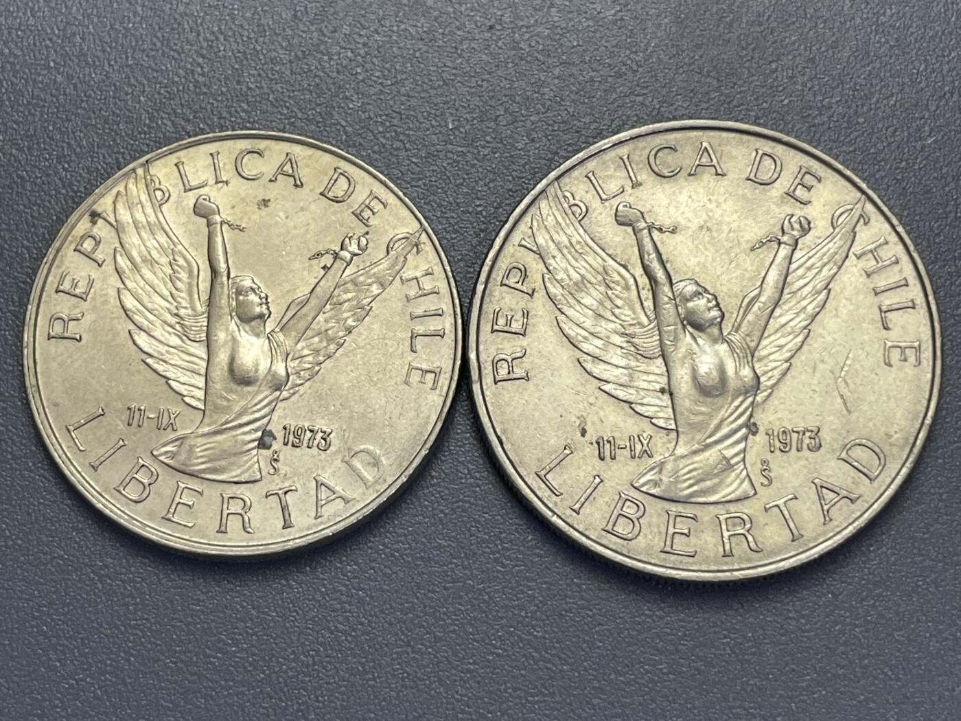 回流1123 智利1973年“自由女神”系列流通硬币（实际发行于1976-1990年，币面标注1973年为纪念日期）带翼自由女神像（双手高举、挣脱锁链，象征1973年智利军事政变后的“自由”叙事）