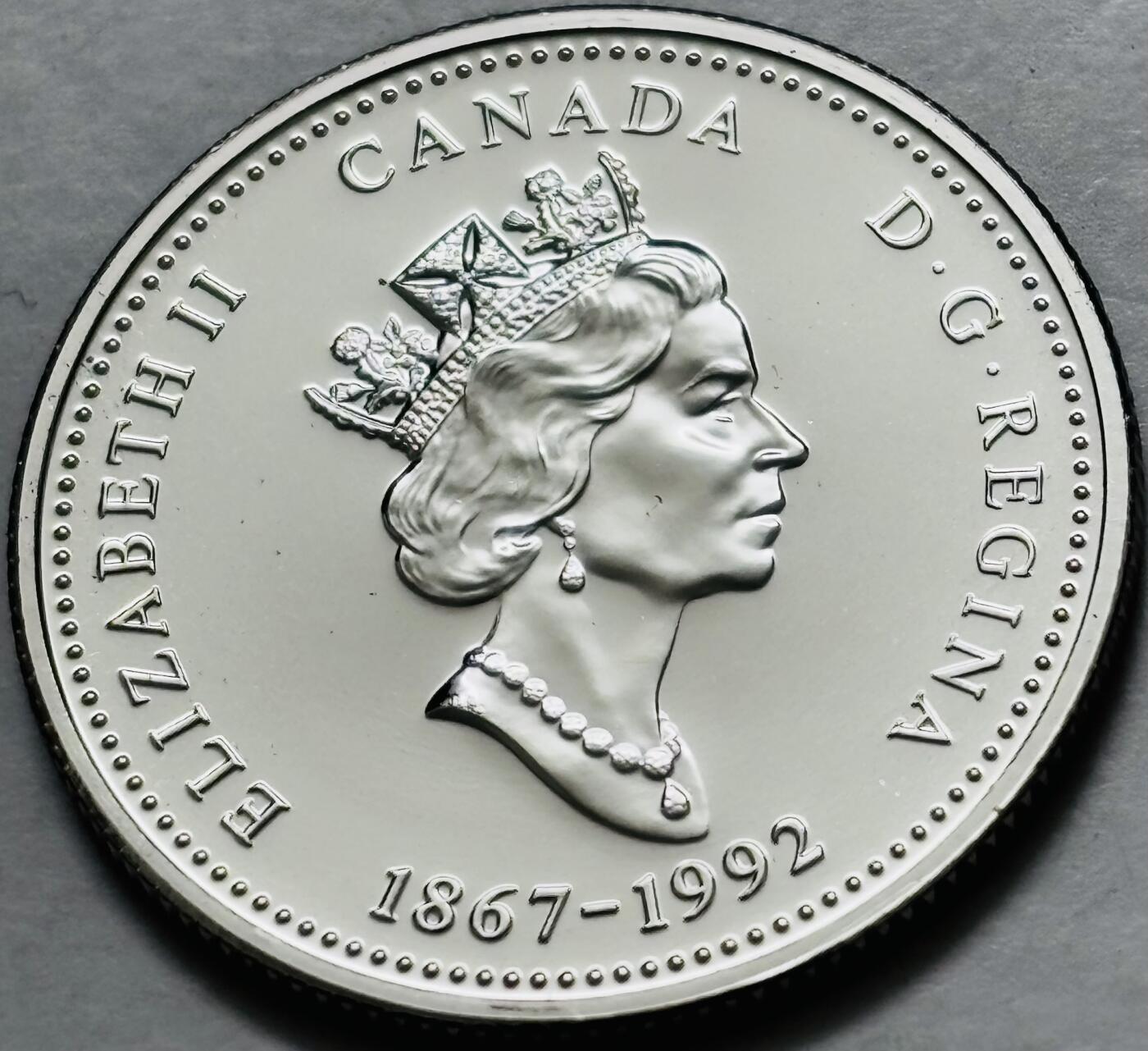 文馨钱币收藏第 282 场，【 长期接收代拍品】，加拿大老铜代用币，银币，德三系列场 少见全新未流通 1992 年加拿大 西北地区成立 125 周年 25 分纪念币