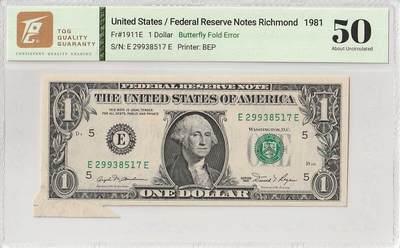 2025十一月第六期，总第204期 - 美国1981年1元TQG50分，由于边角折叠和剪裁失误造成了一种有趣的“福耳”错版