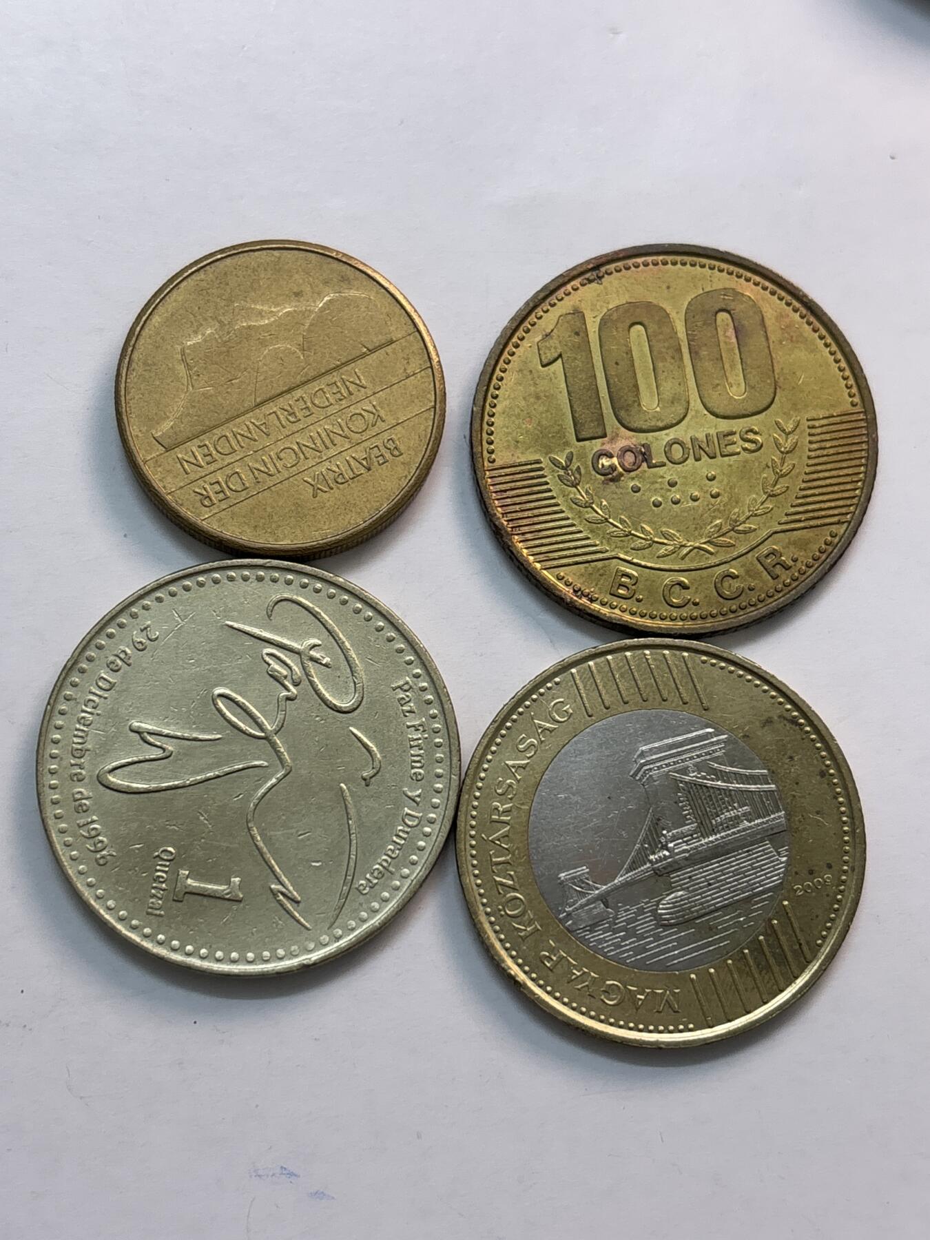 文馨钱币收藏第 282 场，【 长期接收代拍品】，加拿大老铜代用币，银币，德三系列场 荷兰，哥斯达黎加，危地马拉，匈牙利 200 福林，匈牙利单卖一个都要十多块了，共 4 枚