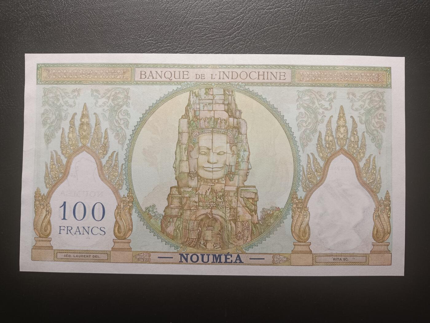 2025十一月第六期，总第204期 法属太平洋-新喀里多尼亚1953版100法郎AUNC无47，加盖首府努美阿地名，法国人格化象征玛丽安娜和四面佛塔