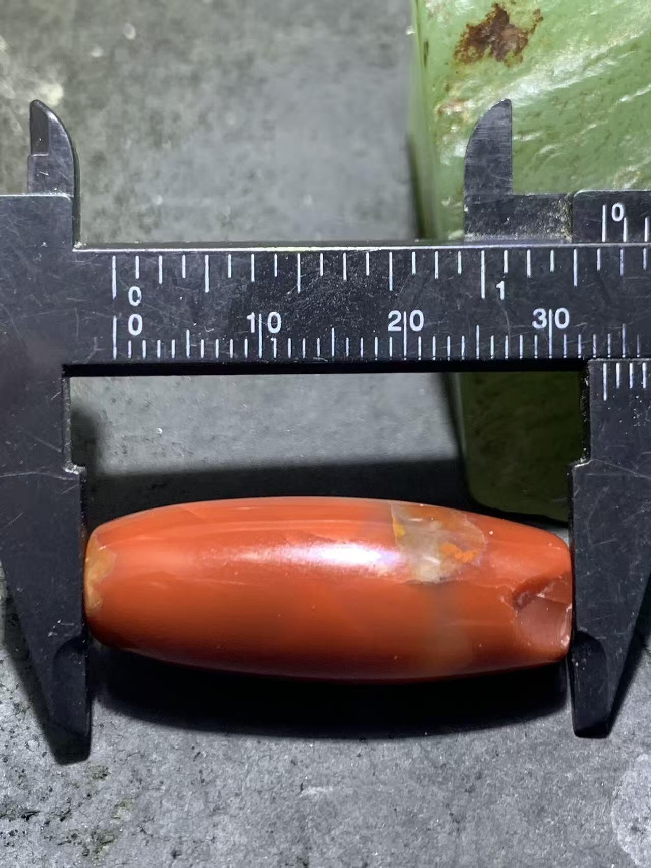 高玉化北漂战国红玛瑙瑕疵桶珠一个！