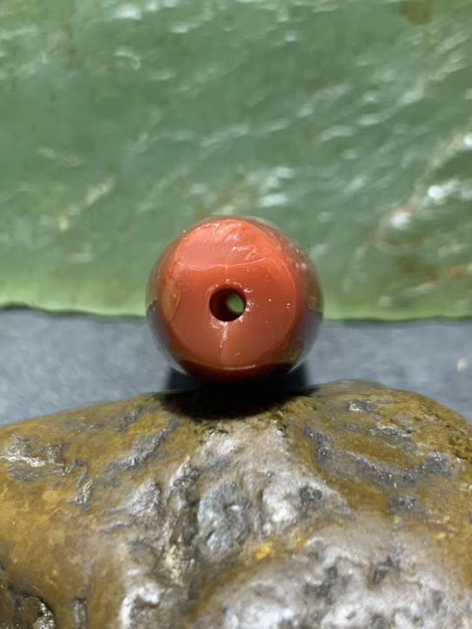 高玉化北漂战国红玛瑙瑕疵桶珠一个！