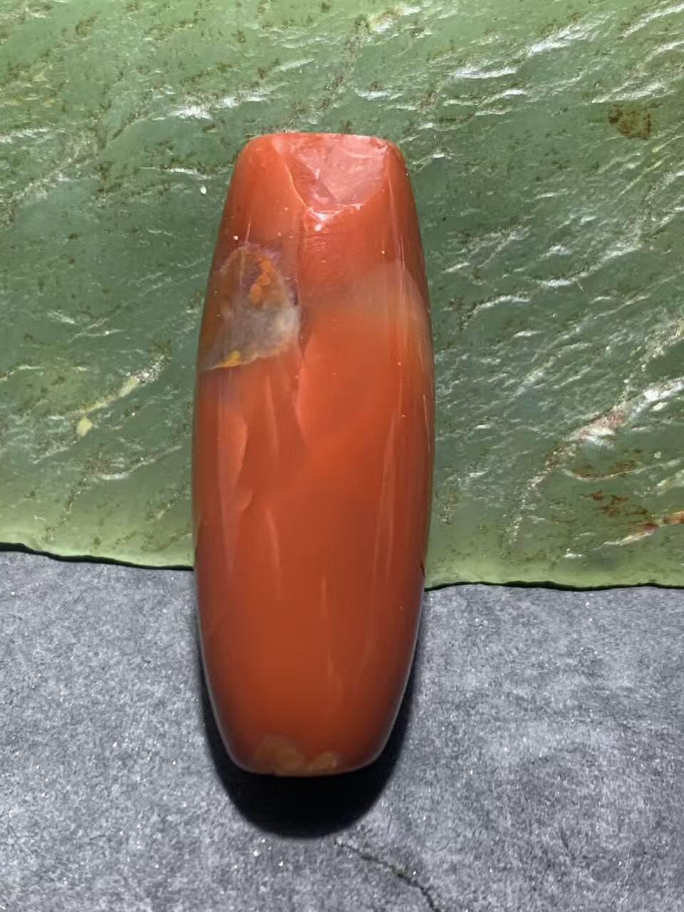 高玉化北漂战国红玛瑙瑕疵桶珠一个！