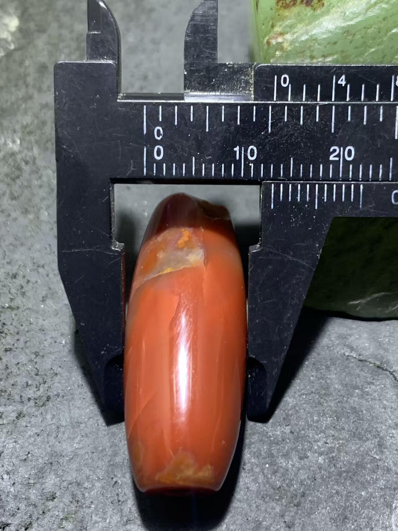 高玉化北漂战国红玛瑙瑕疵桶珠一个！