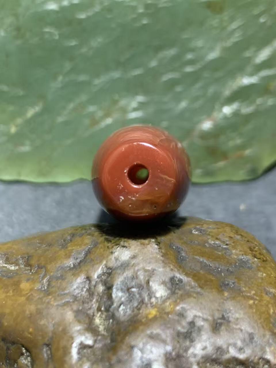 高玉化北漂战国红玛瑙瑕疵桶珠一个！